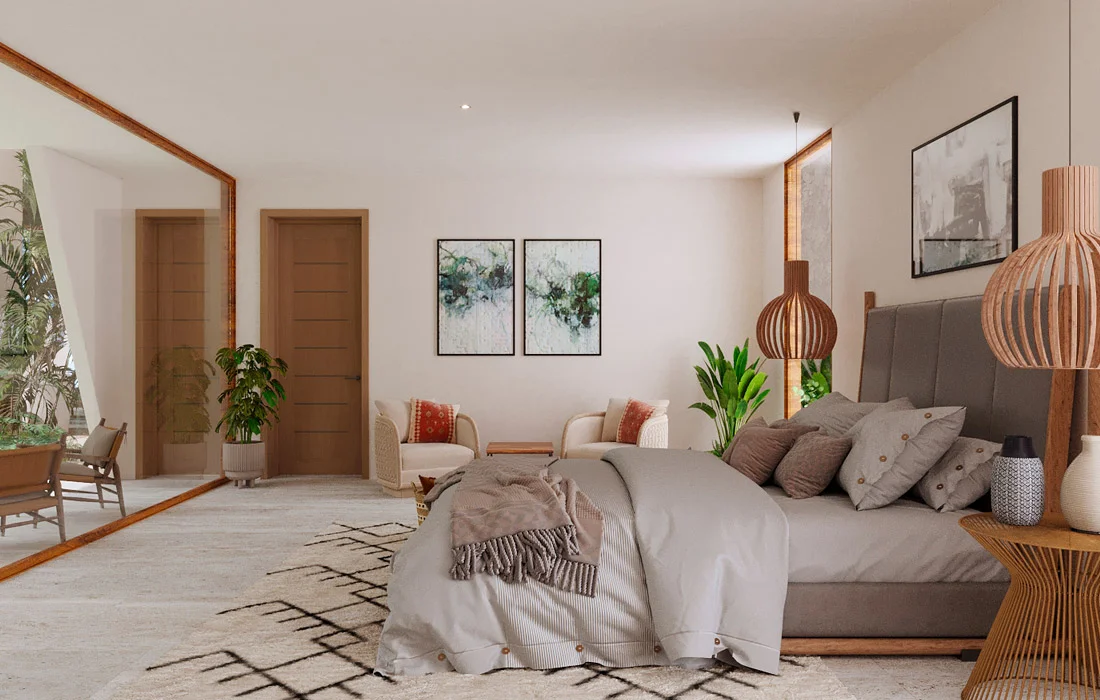 Recámara principal de Casa Sept con cabecera capitonada, lámparas de madera y rincón de lectura