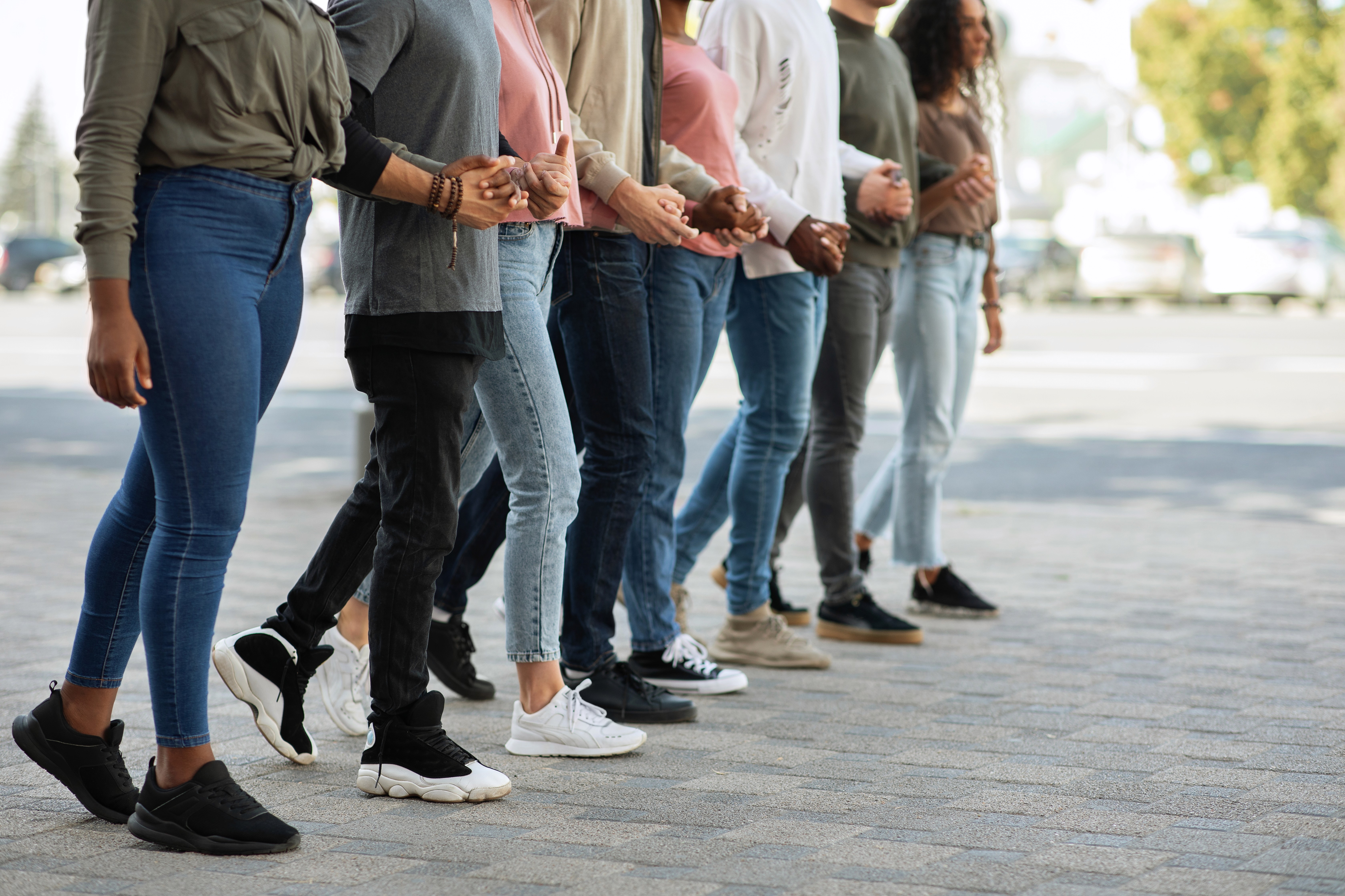 man wearing gray polo shirt beside dry-erase board