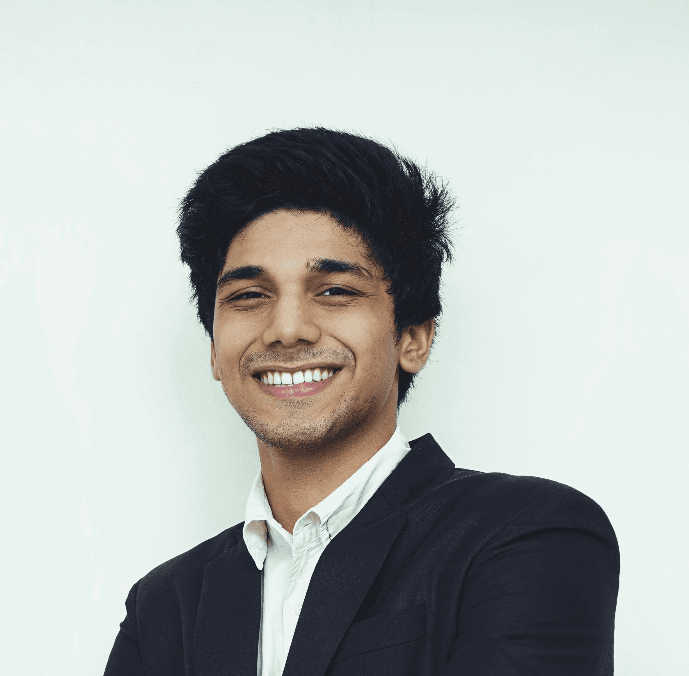 man in black suit jacket smiling