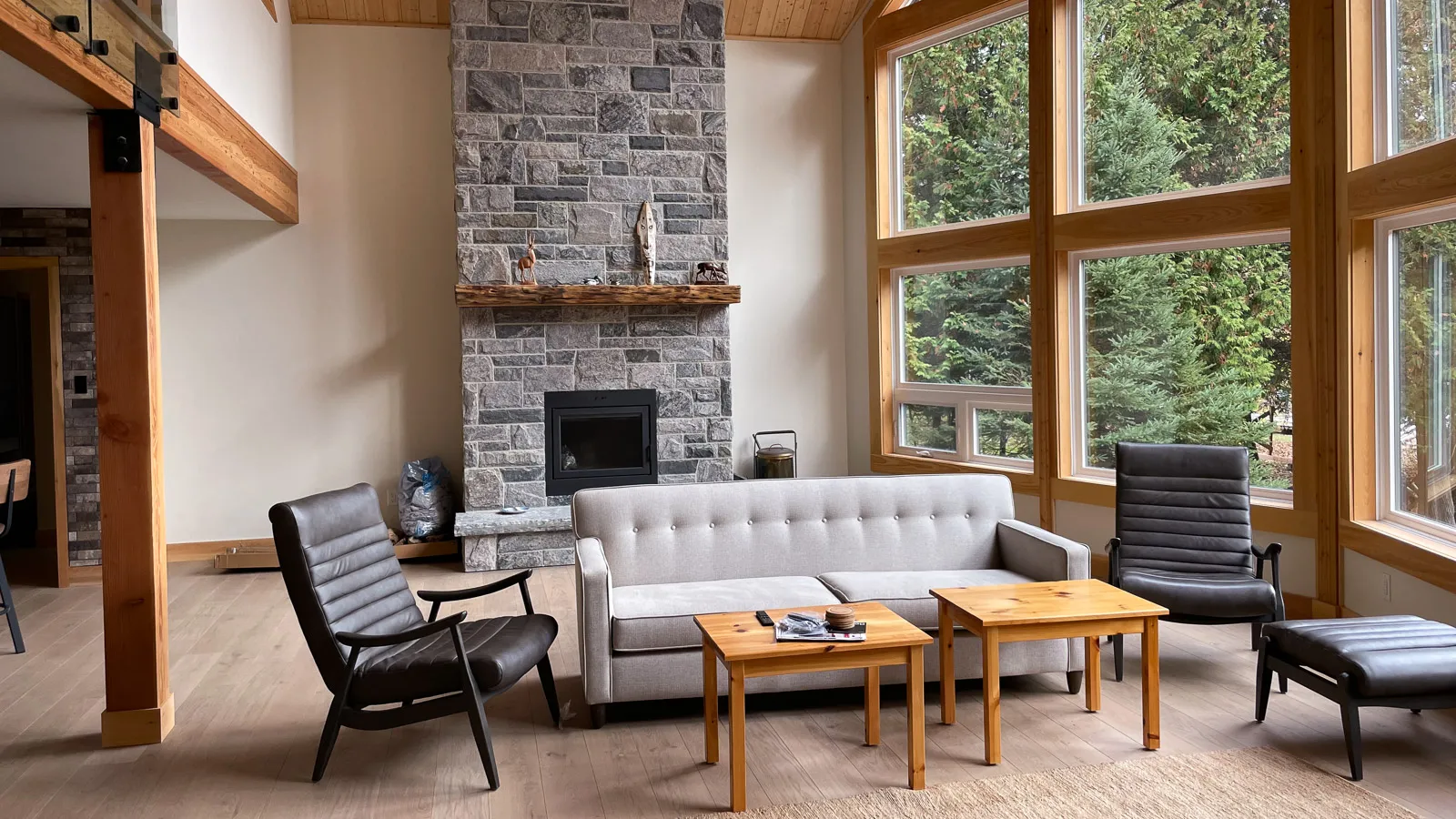 Canning lake cottage with luxury furnishings exposed wood beams and a granite chimney.