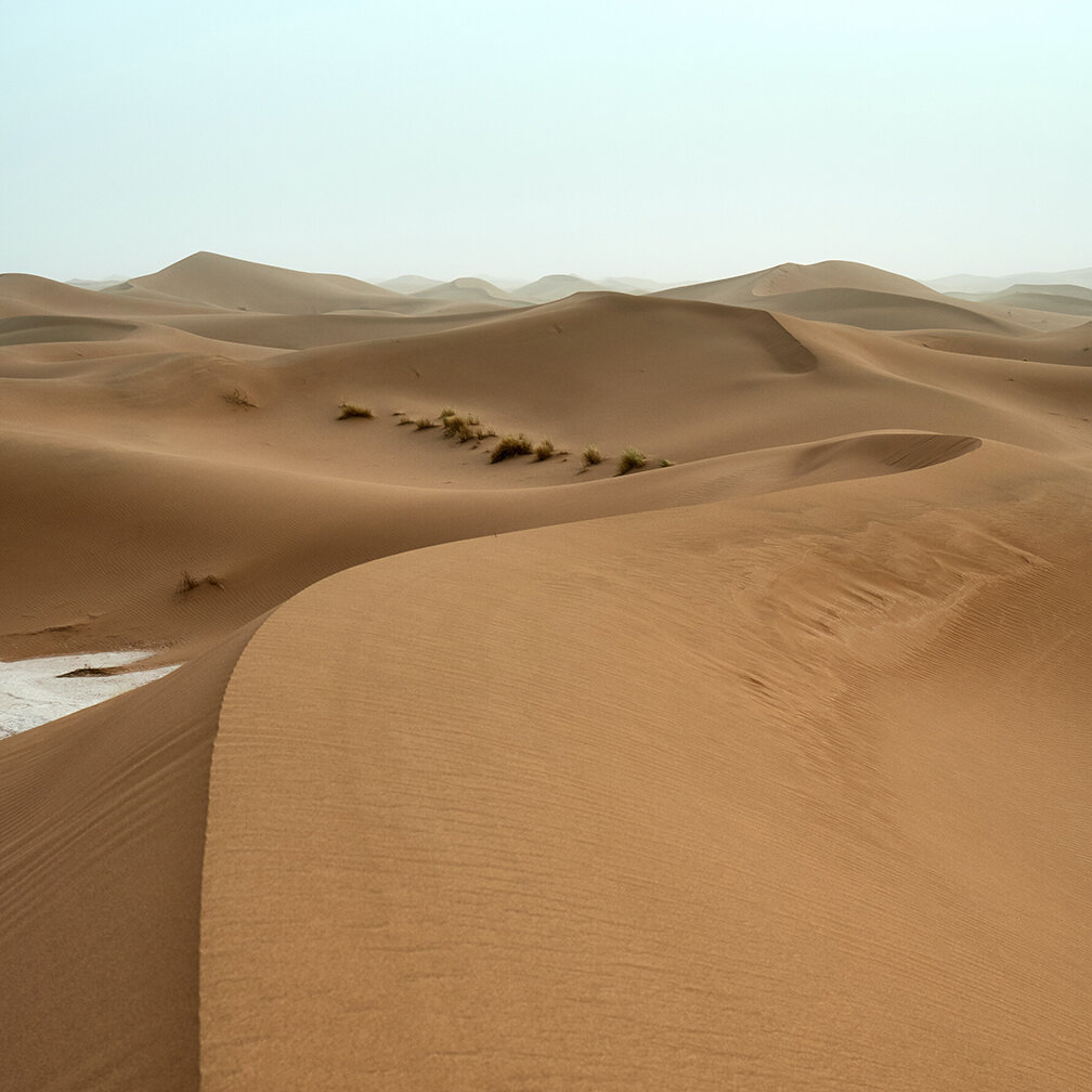 Sand dunes in a desert, representing the earth element