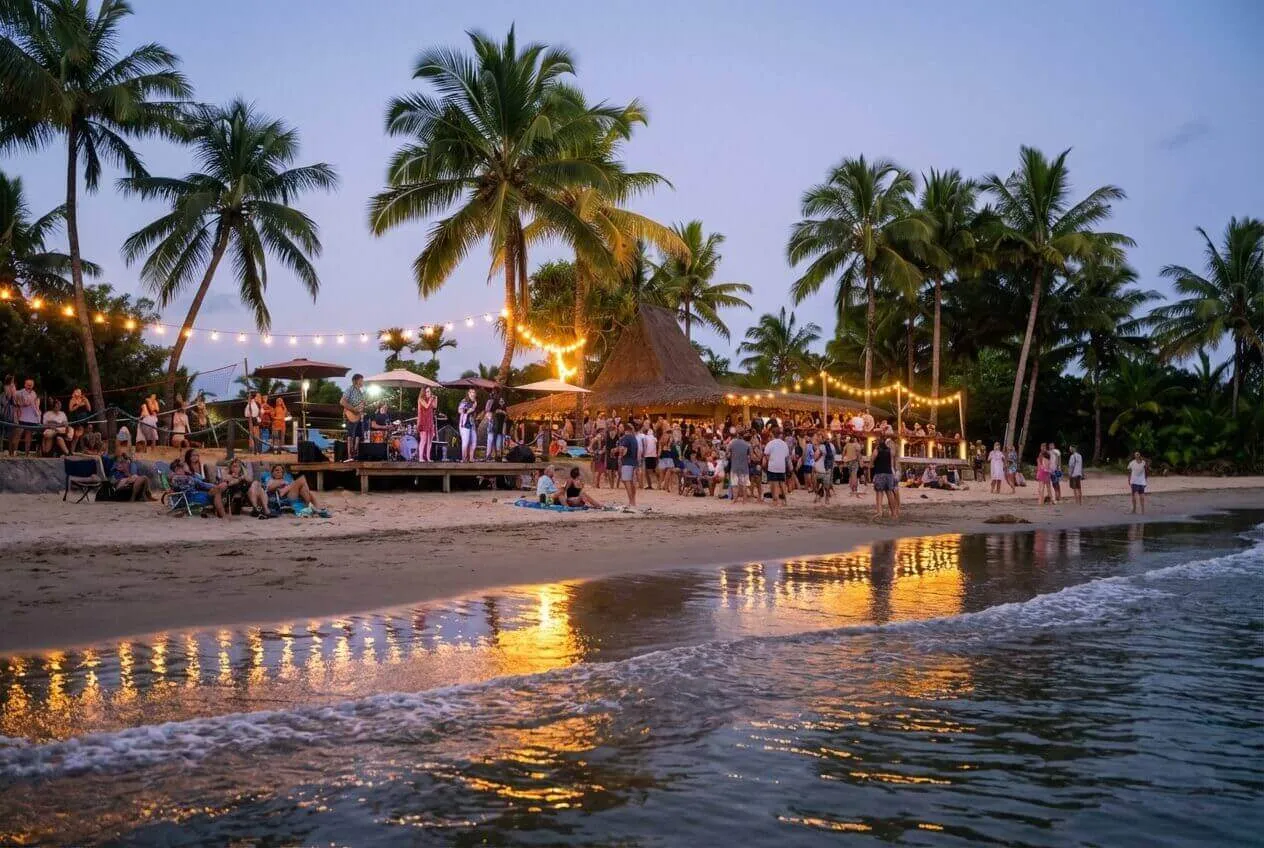 Live band on stage at a lively beachfront bar with string lights at Uprising Beach Resort, Pacific Harbour, Fiji.