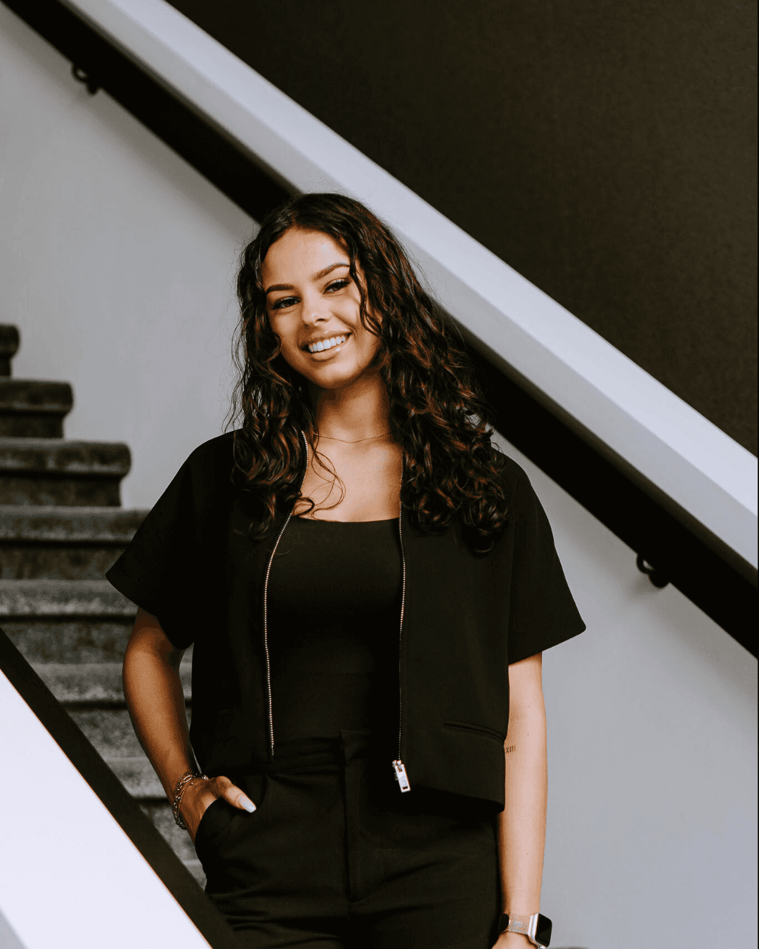 woman in white crew neck shirt smiling