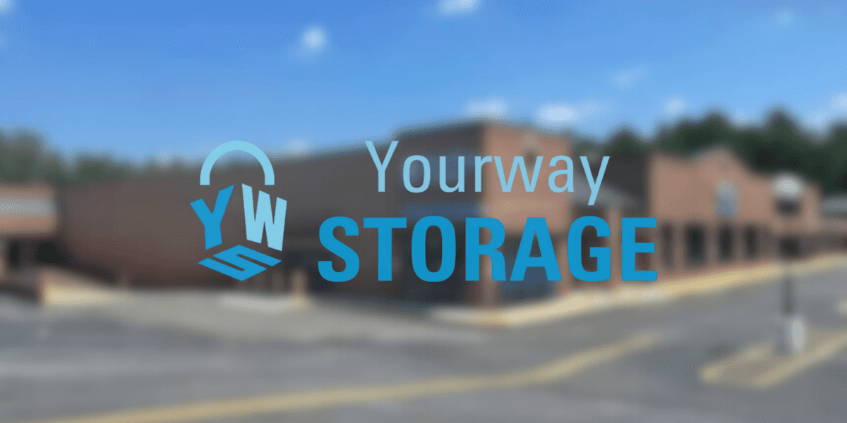 Blurred background of a storage facility with the 'Yourway Storage' logo in the foreground.