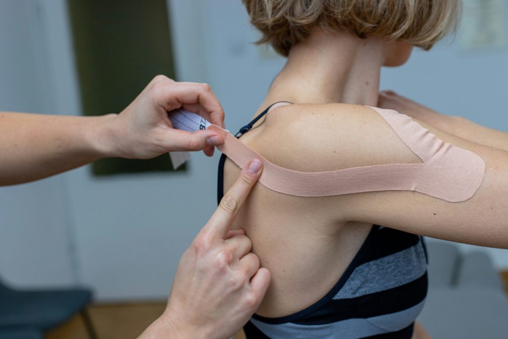 woman wearing shoulder support ribbons