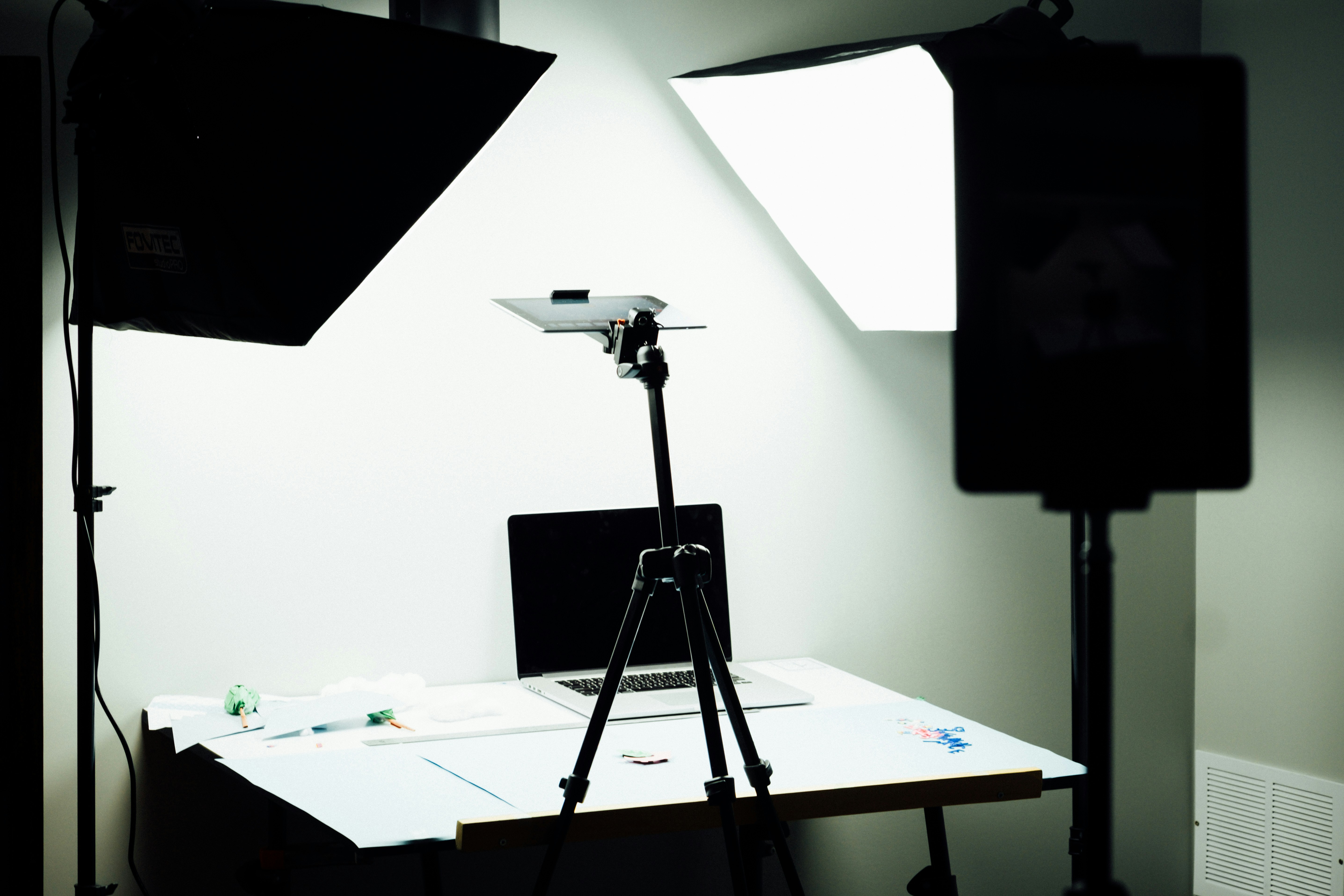 Professional studio setup with camera, tripod, lighting, and a tabletop ready for high-quality product photography.