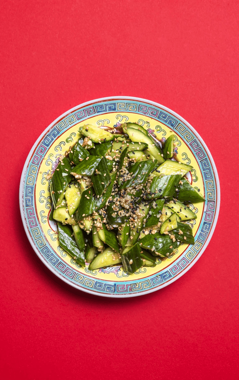 wine glass on table and a plate of pasta