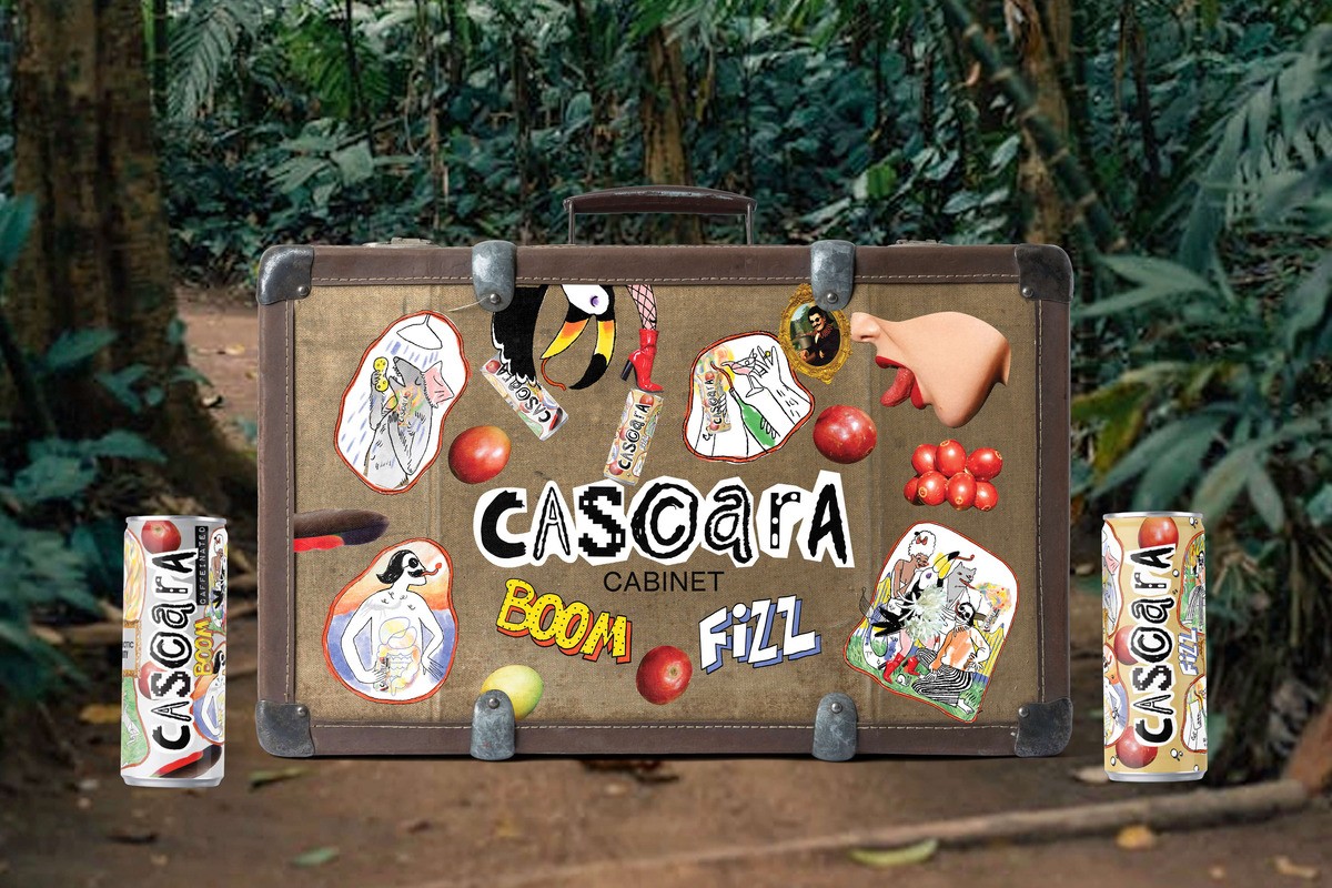 Vintage suitcase covered with Cascara Cabinet Boom and Fizz stickers — symbolising global brand adventure.