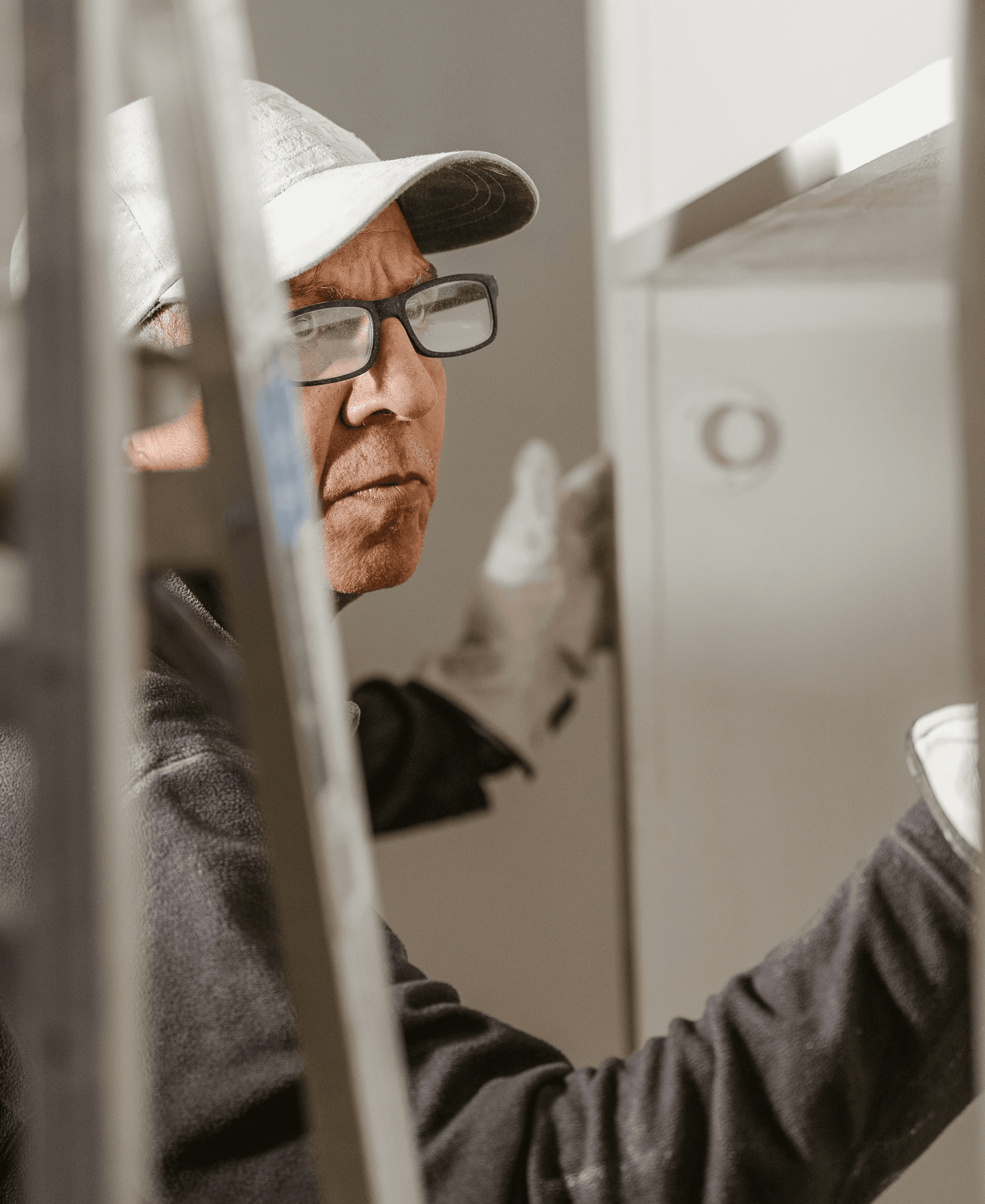 a man wearing a hat and glasses