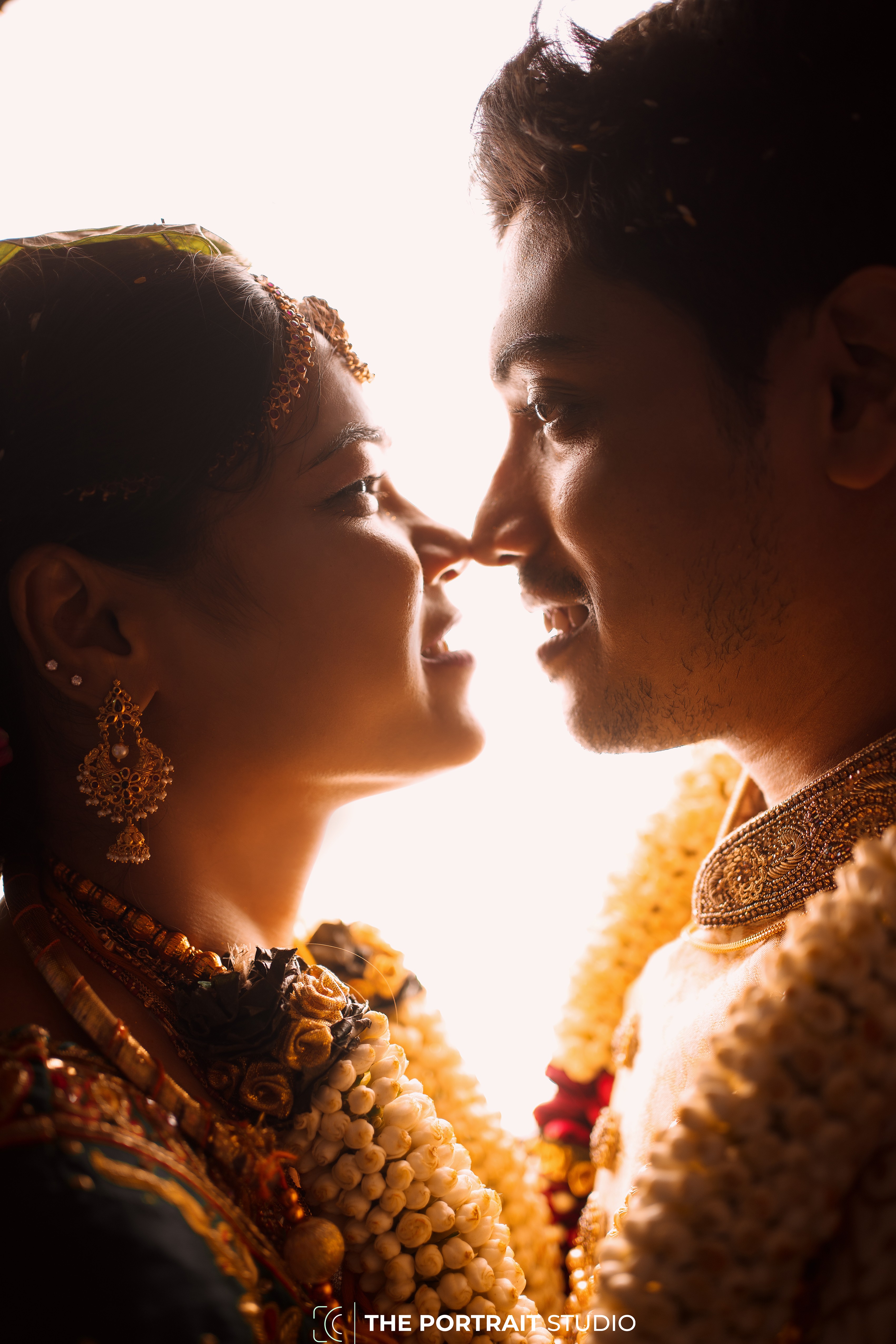 a woman in a white dress holding a bouquet of flowers