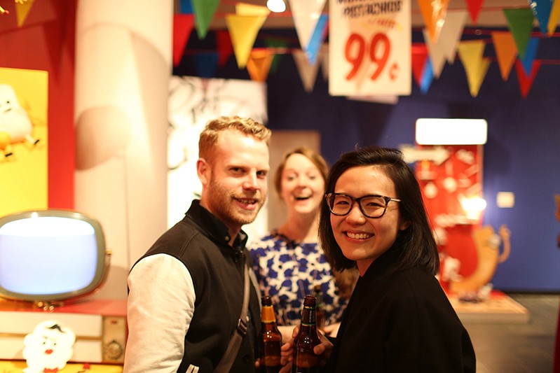 students smiling with beers