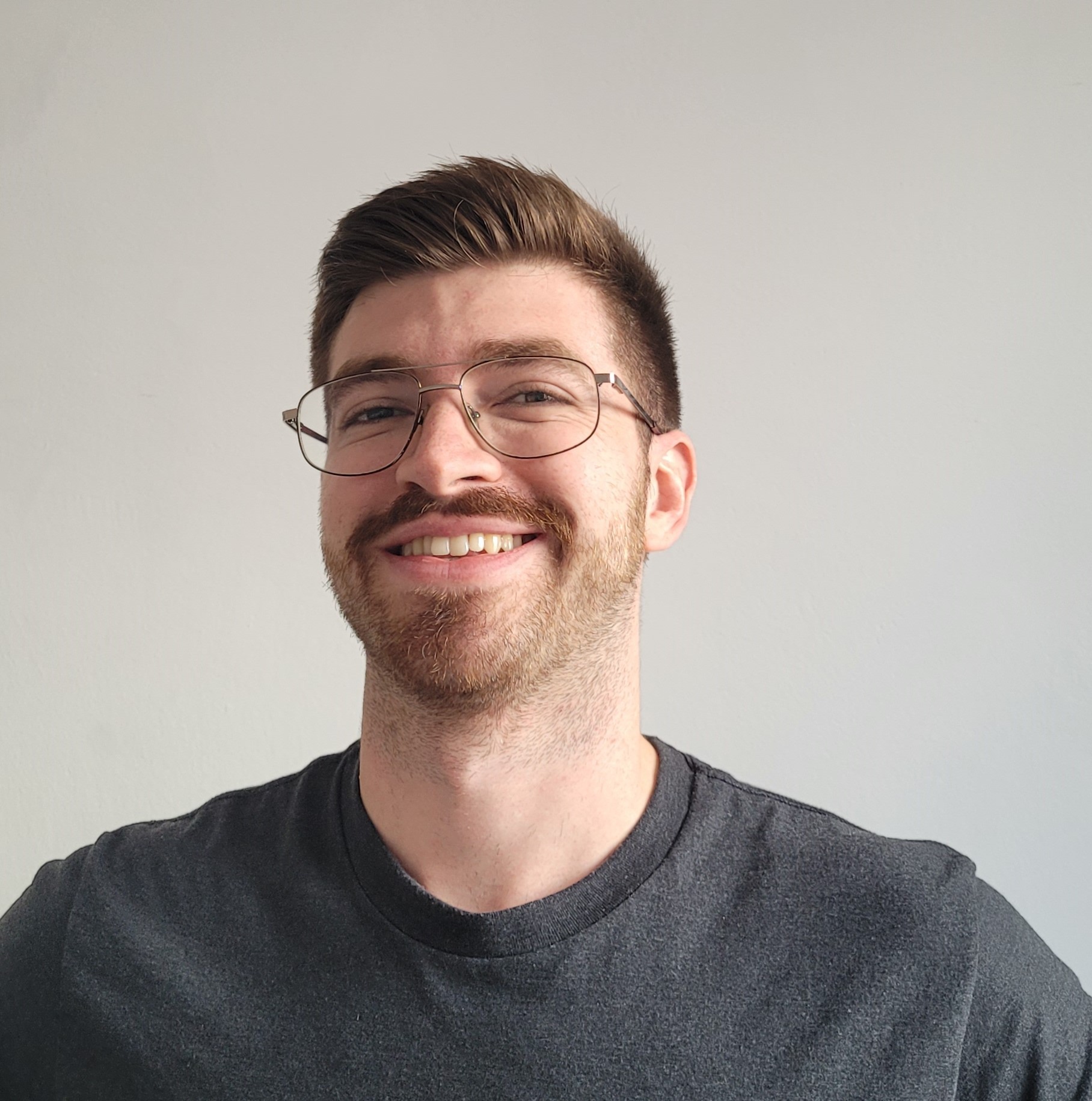 A portrait of a young man smiling