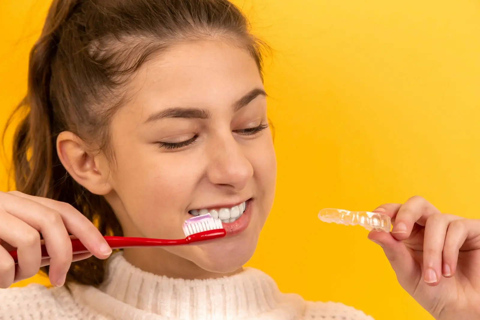 Smiling child holding a toothbrush