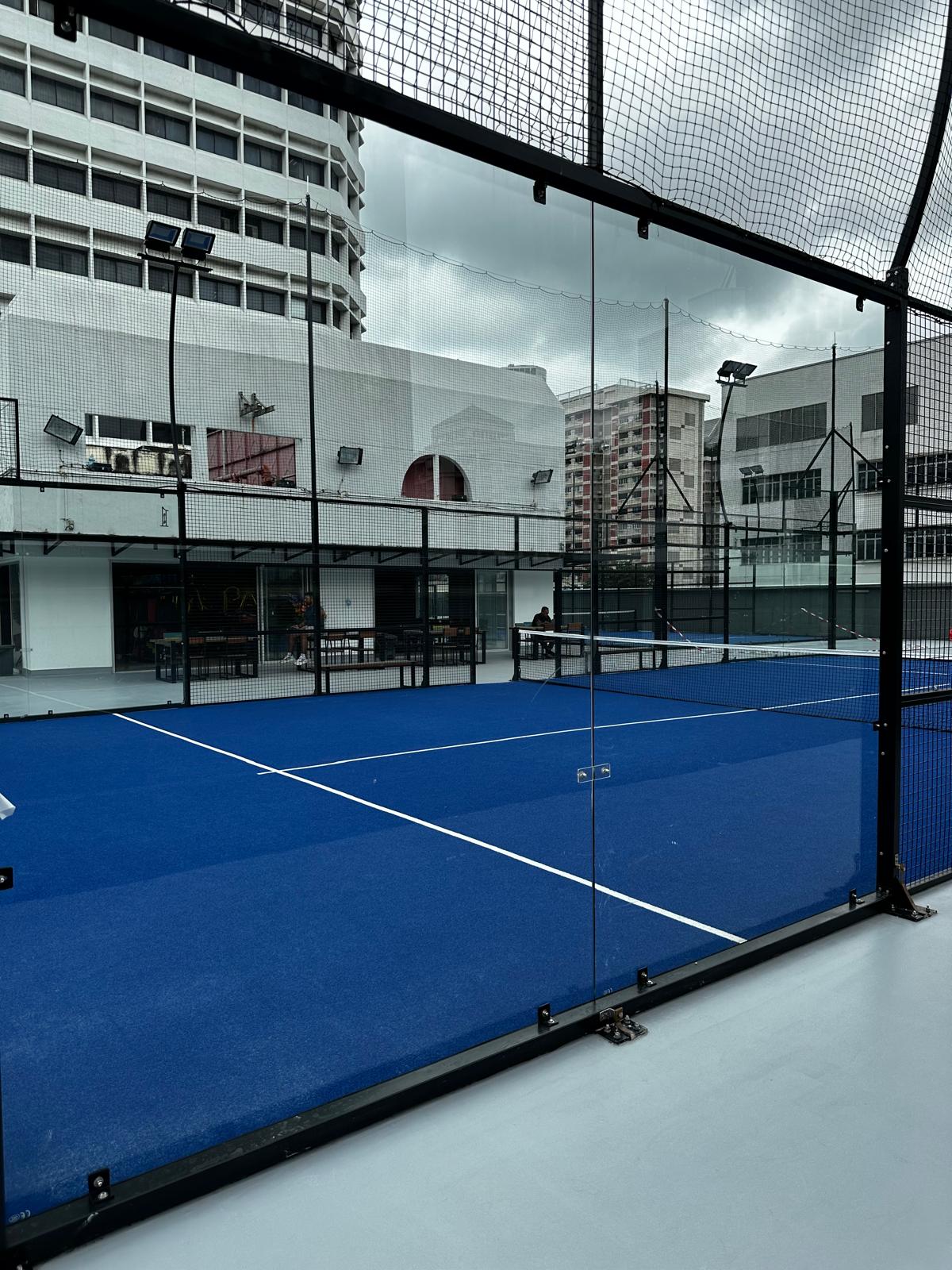 a tennis court with a fence surrounding it