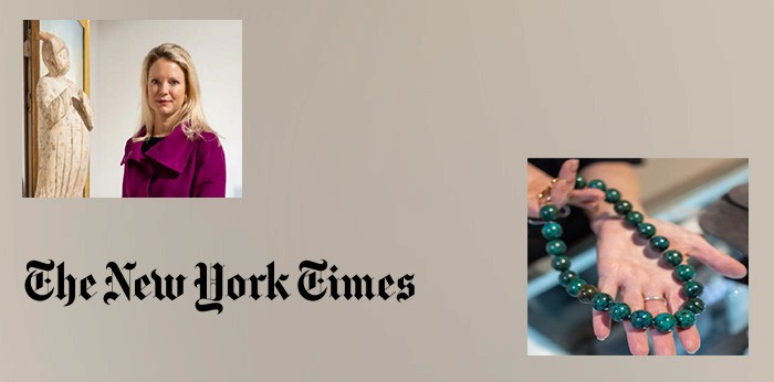 a close up of a necklace on a wooden plate