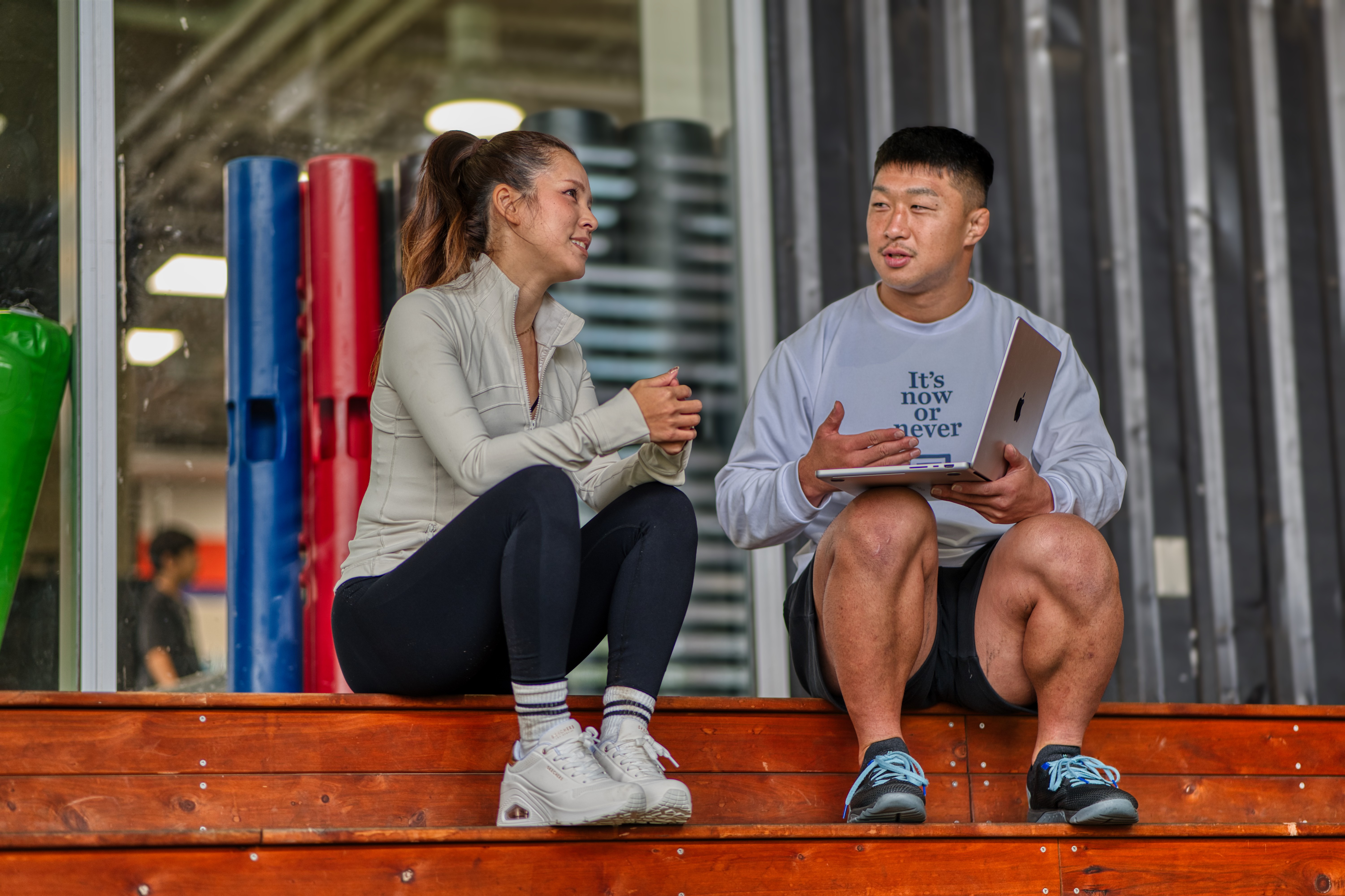 Coach and client reviewing a training plan together on a tablet