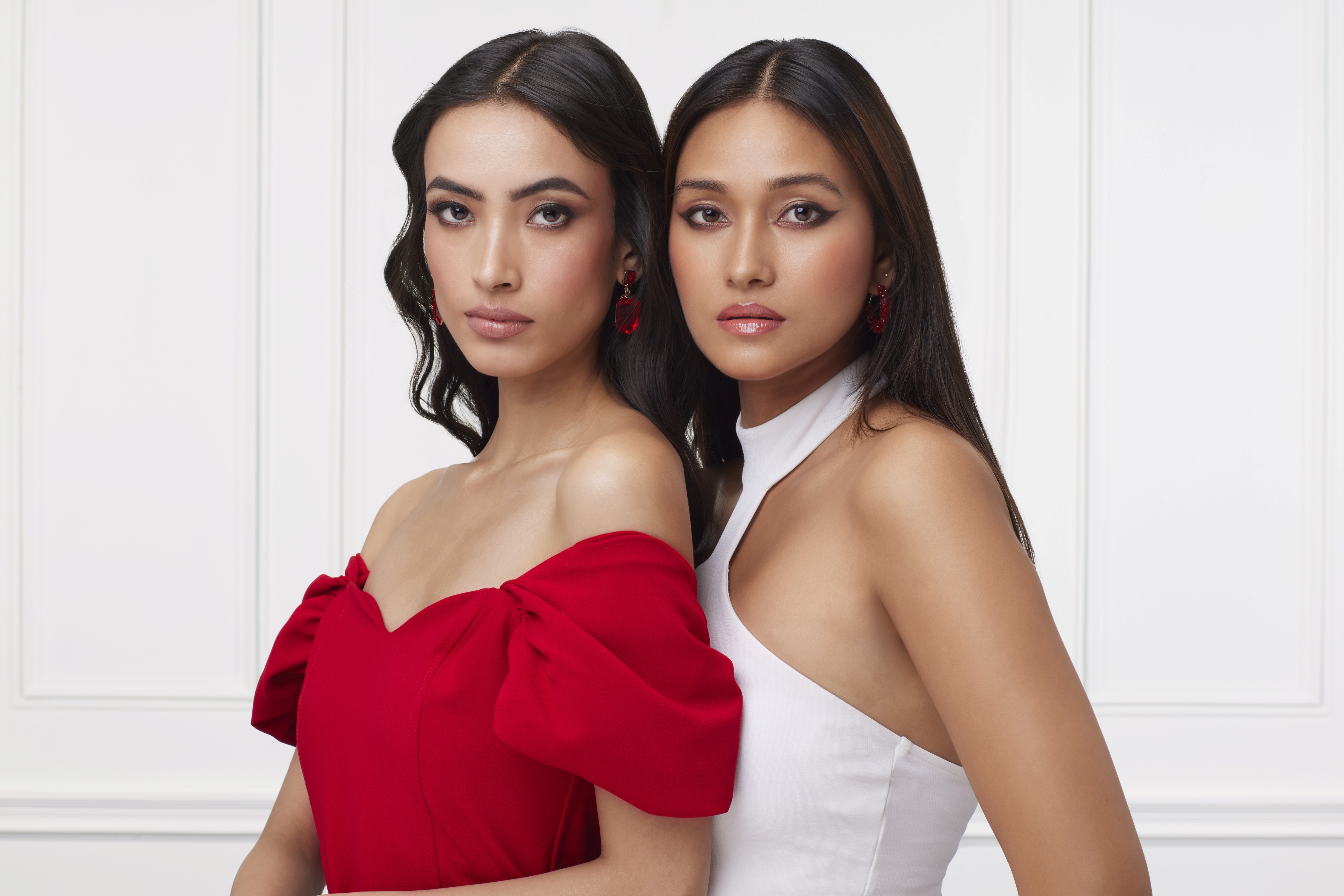 People playing soccer on a rooftop court surrounded by city buildings