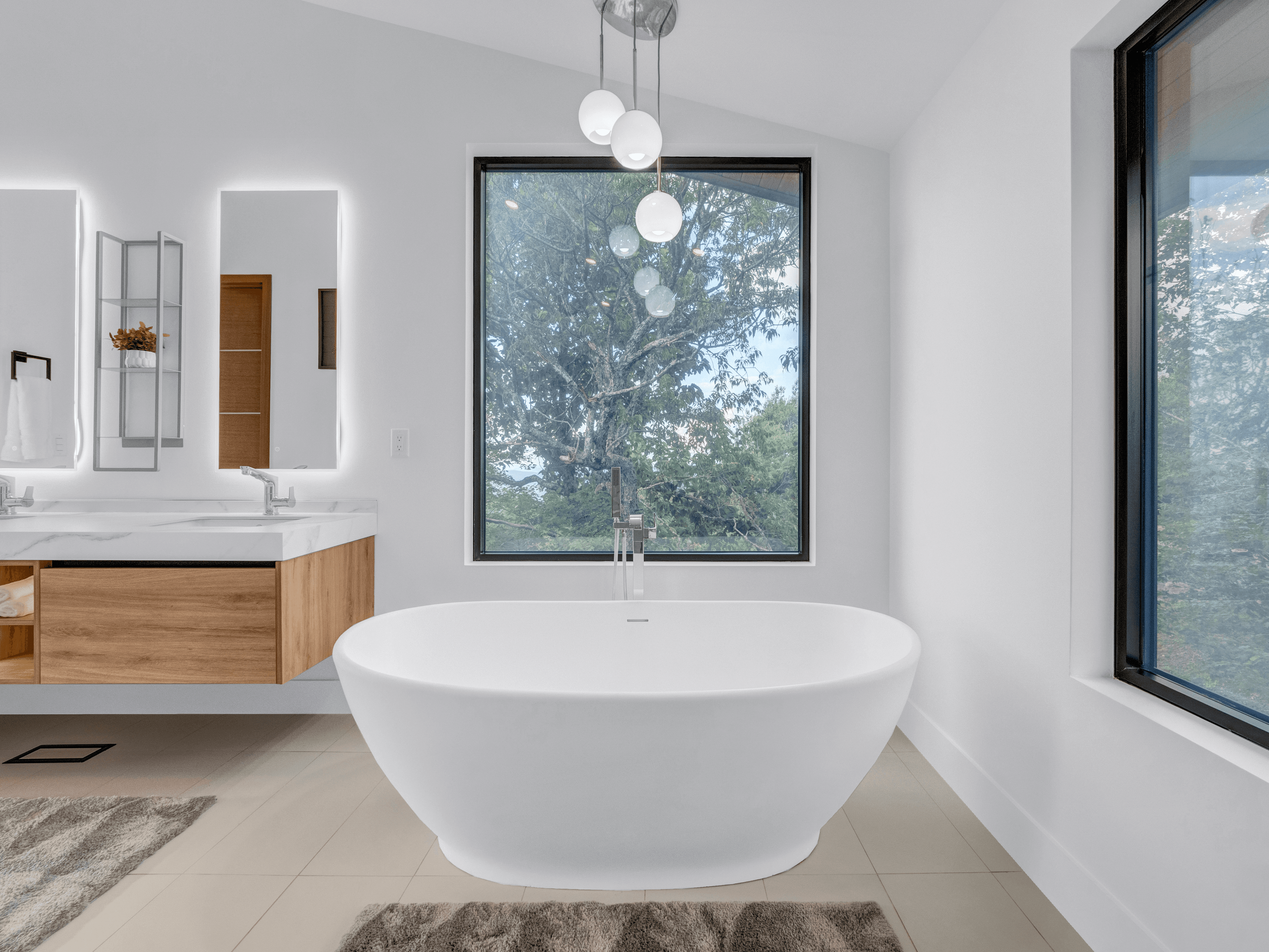 Primary ensuite bathroom with soaking tub and mountain views at Beech Harmony