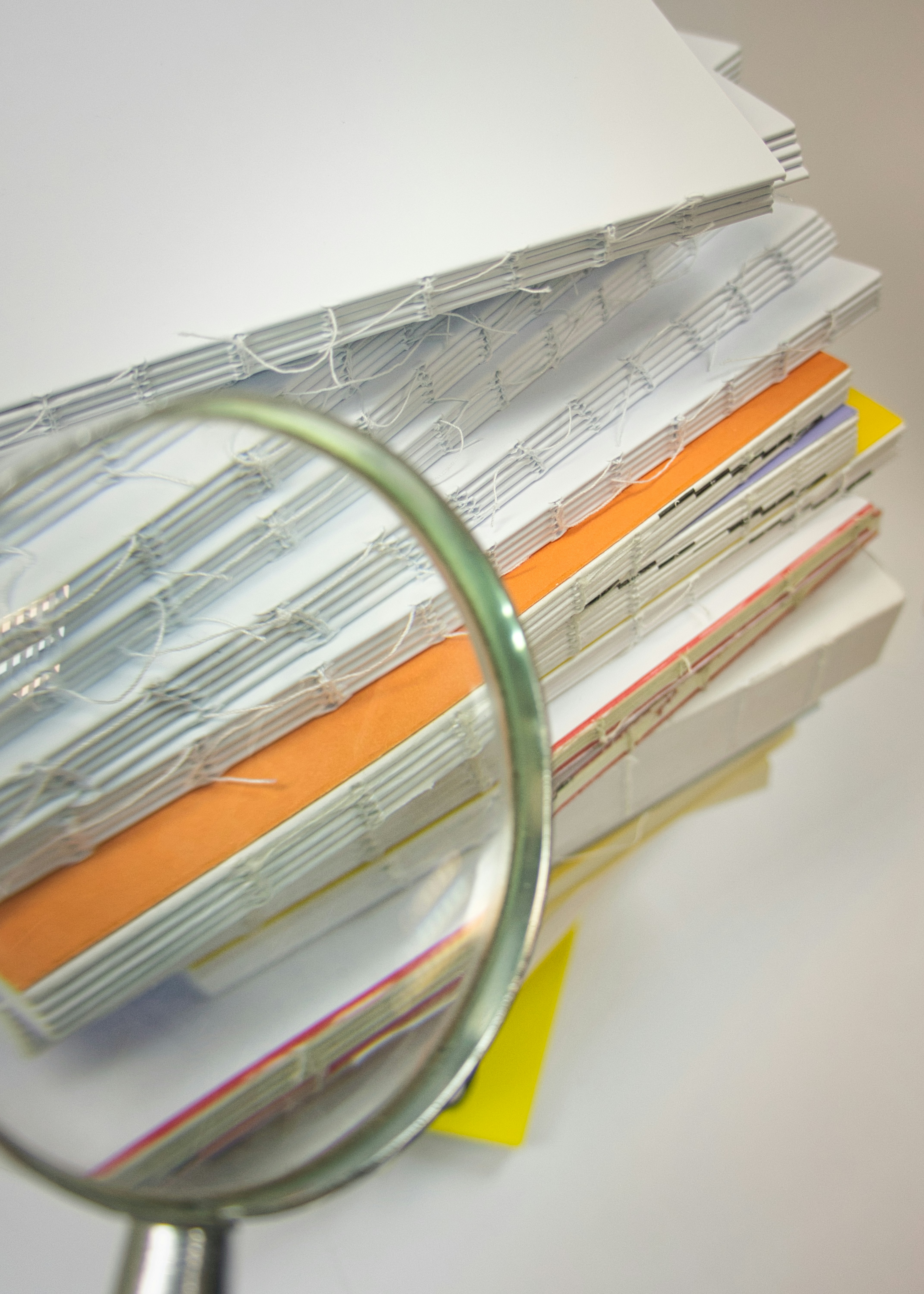 stack of books on white table