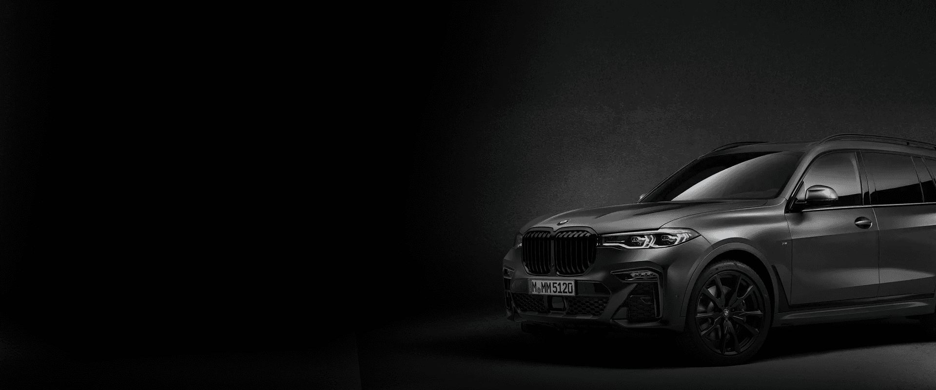 A cheerful car renter talking to an excited young child ready to drive a sportscar, ideal for car rental family moments.