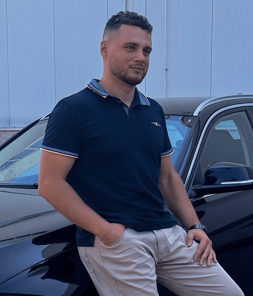 A car salesman inside of a car