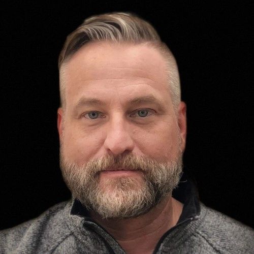 a black and white living room with a large tv
