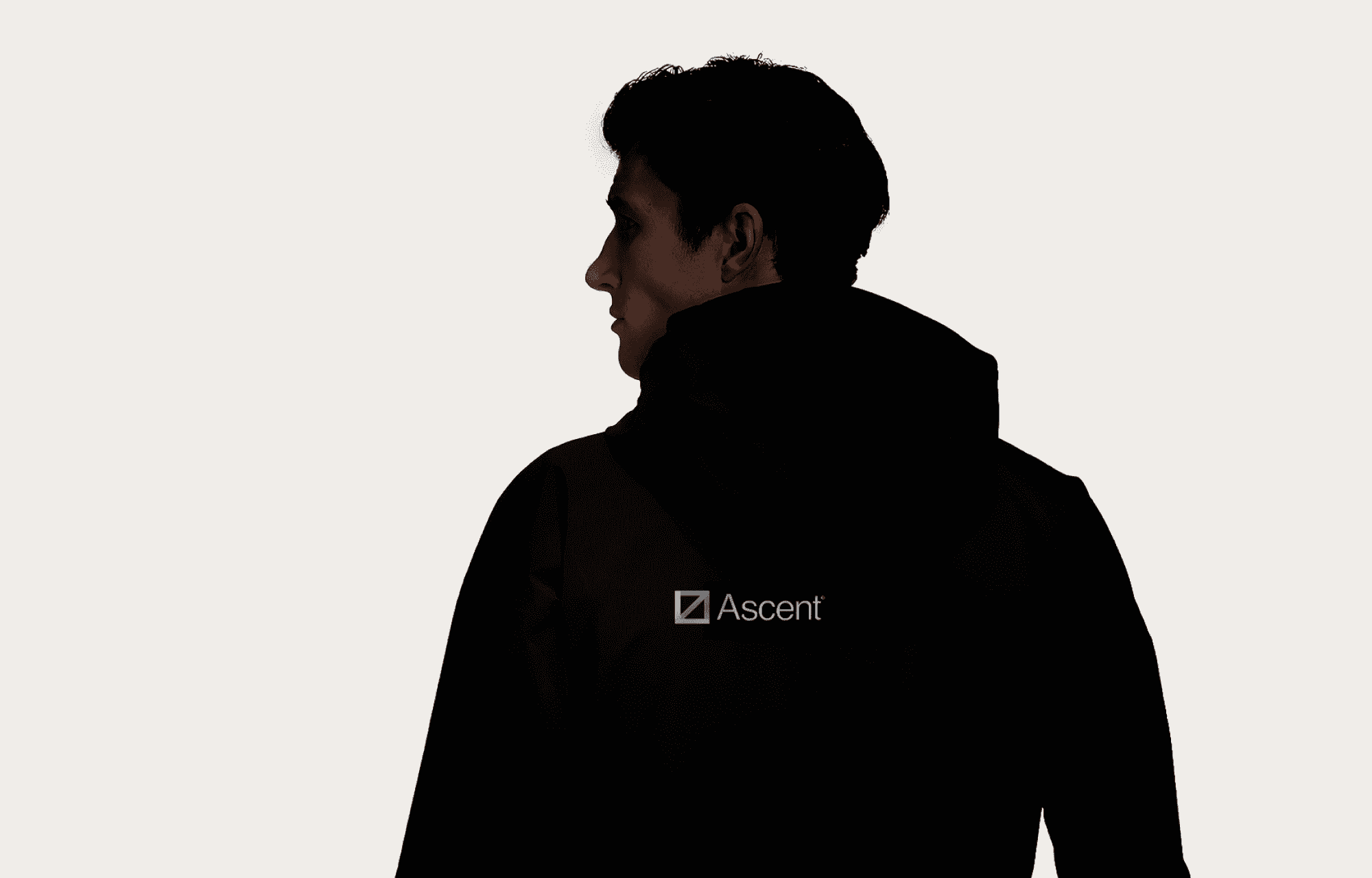 Man facing away with black hoodie ascent logo