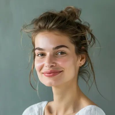 Brunette woman with tied hair smiling, natural light, landscaping client testimonial portrait
