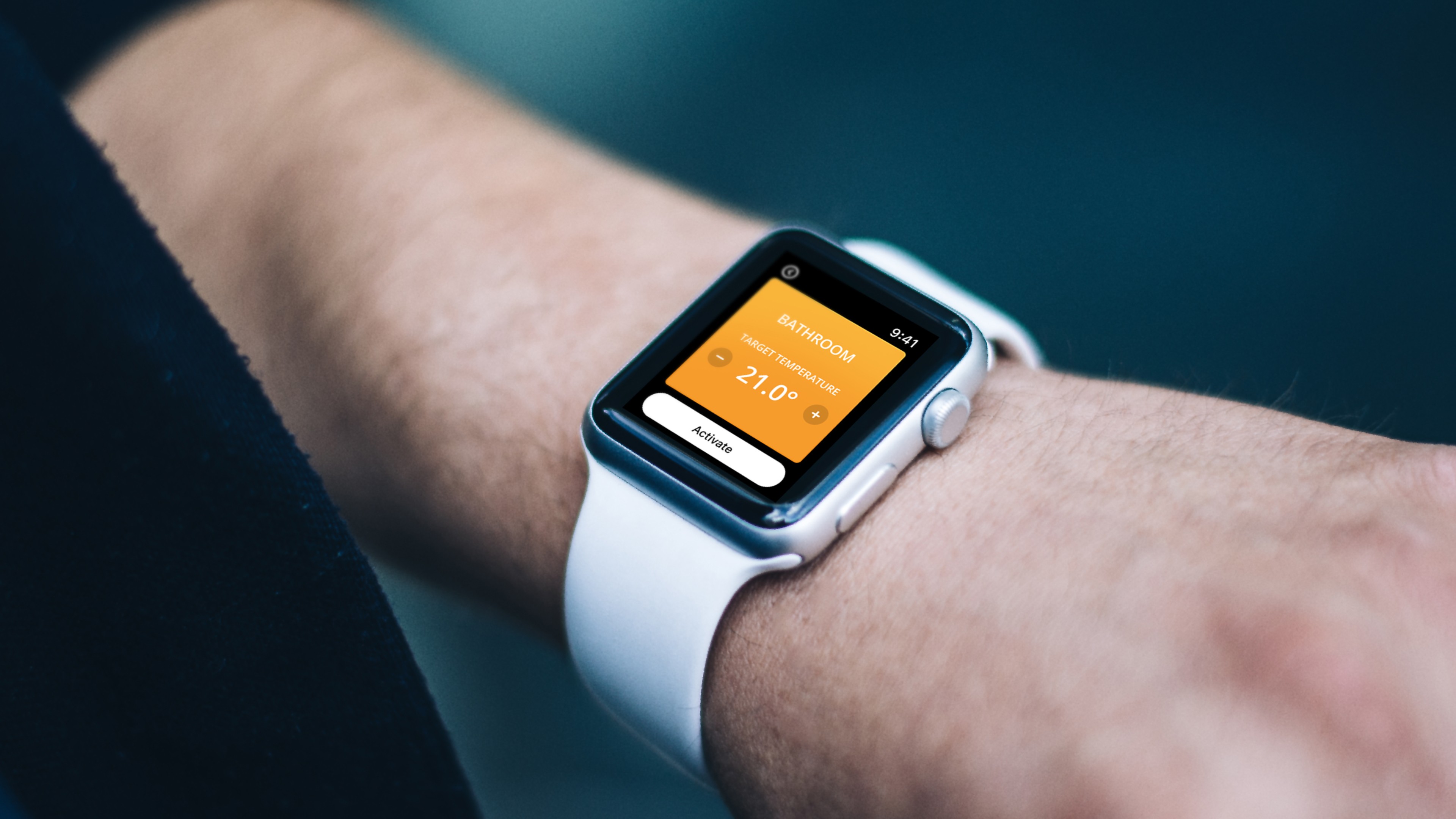 Smartwatch showing Honeywell bathroom temperature setting screen at 21 degrees