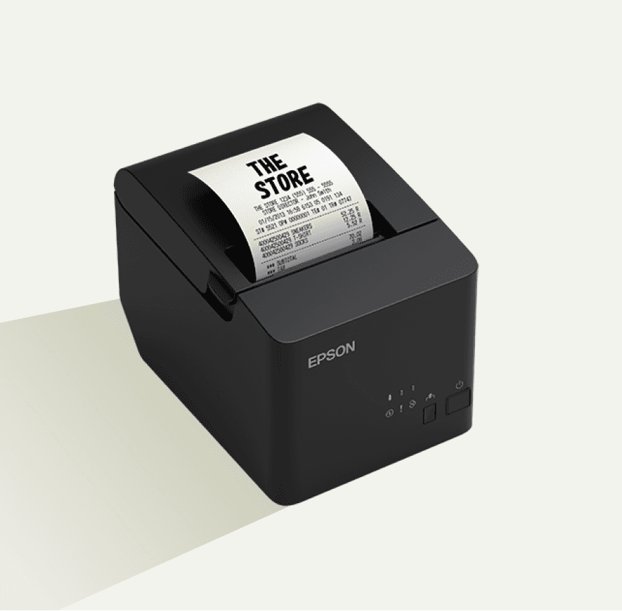 A black Epson receipt printer with a store receipt that has 'THE STORE' printed on top.