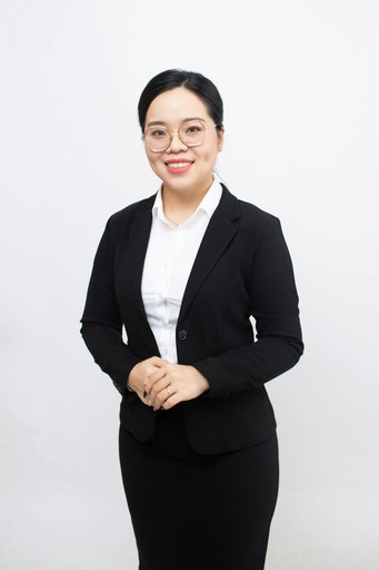 A woman in a business suit posing for a picture