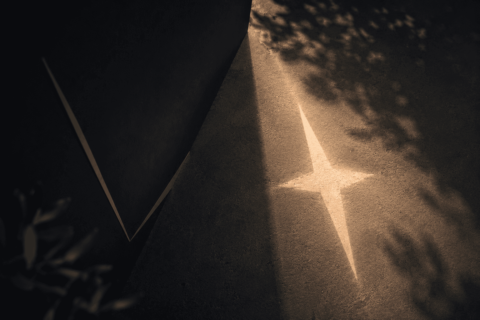 Sunlight casting a four-point star on a wall, echoing the Aspect, Mernda brand mark
