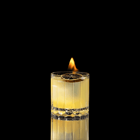 A closeup of a My Clementine drink against a dark background.