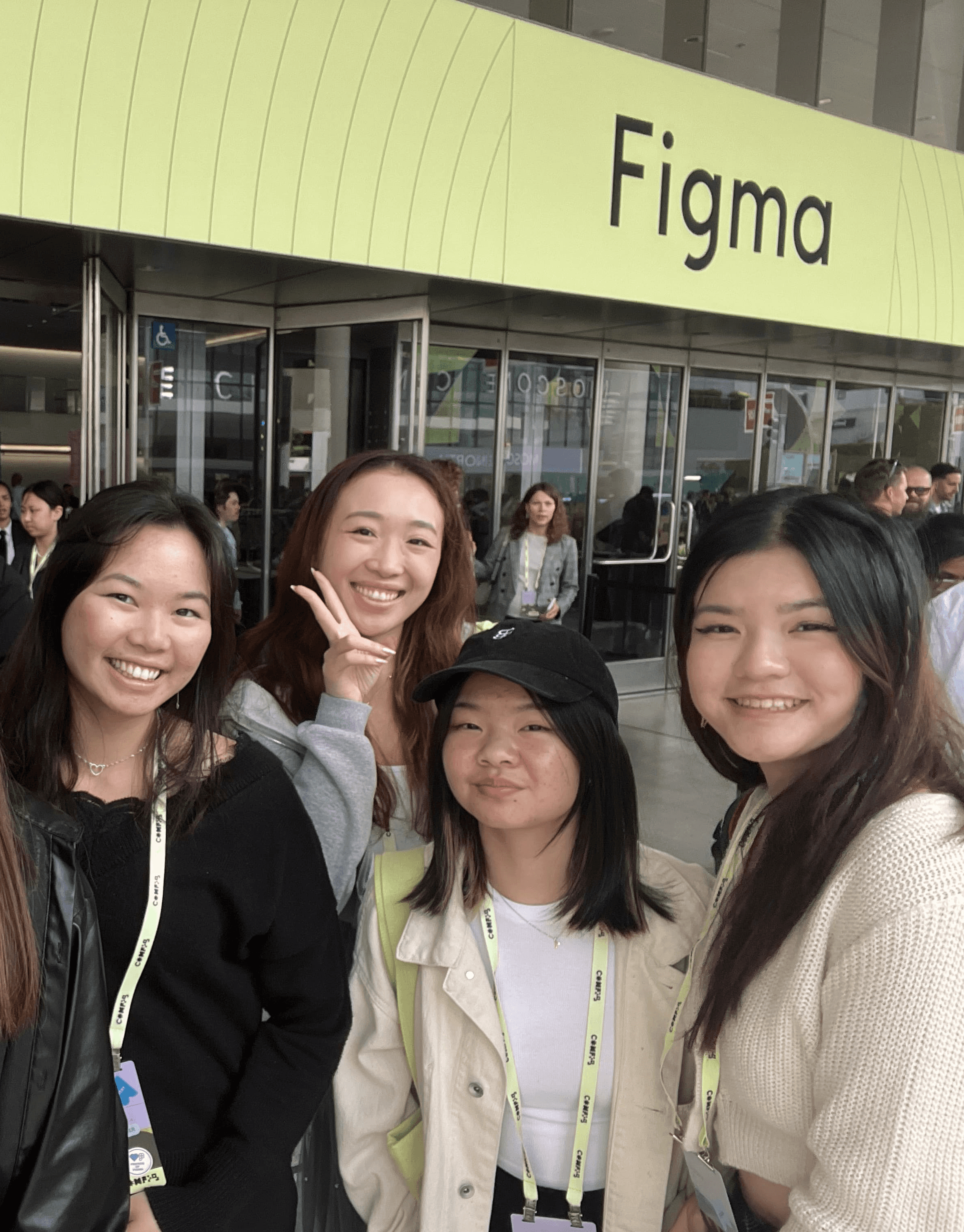 Picture of four girls in front of a Figma sign