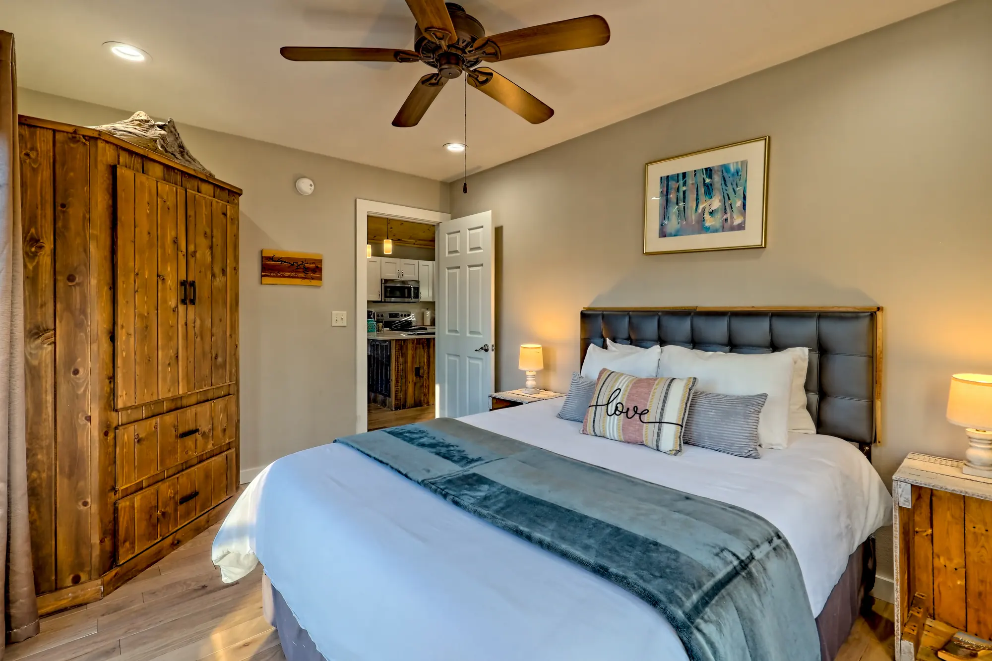 Eagles Landing second queen bedroom with a wood armoire