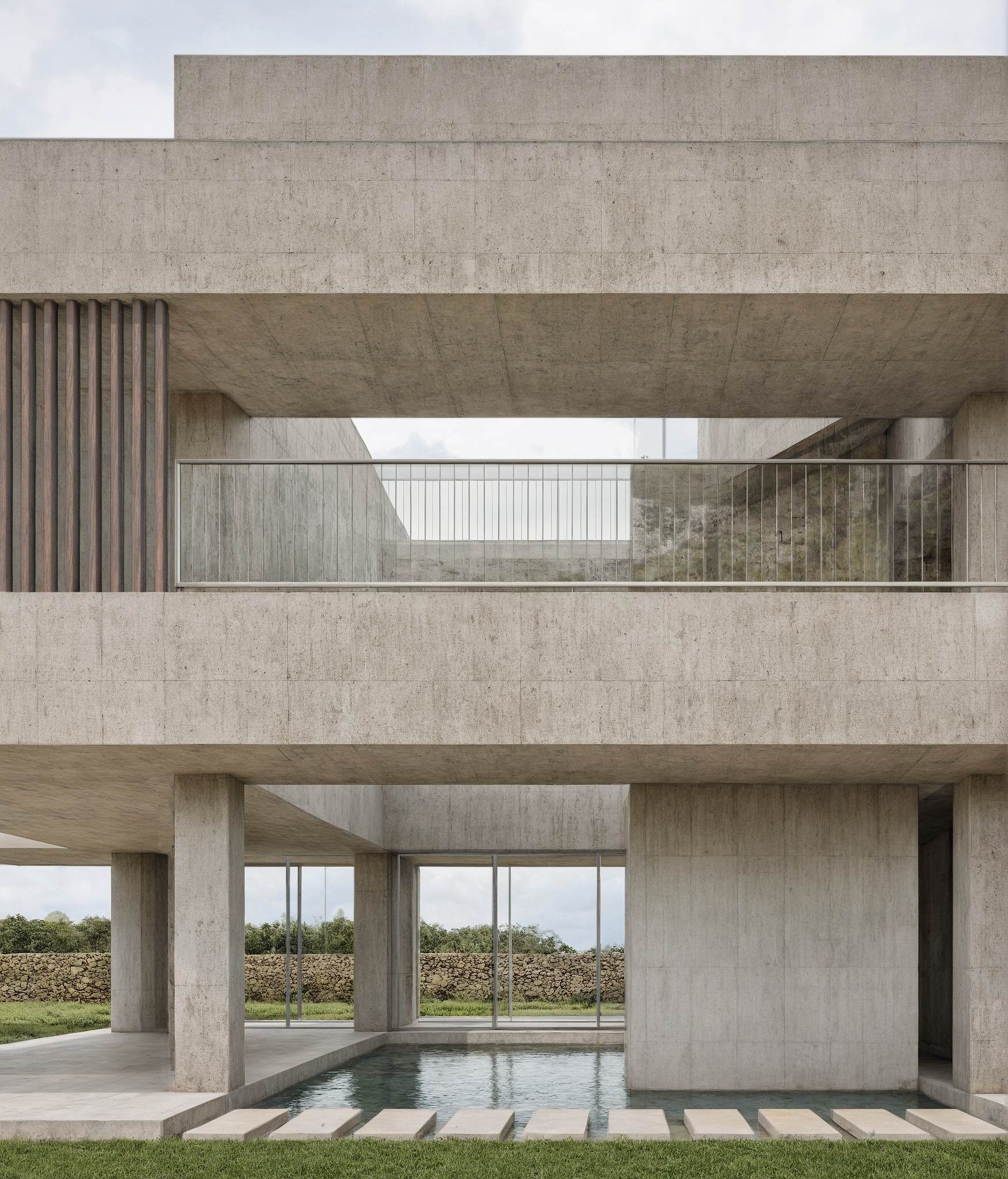 廣闊混凝土建築中庭設計，幾何量體與光影構成強烈建築語彙，中央可遠眺景觀