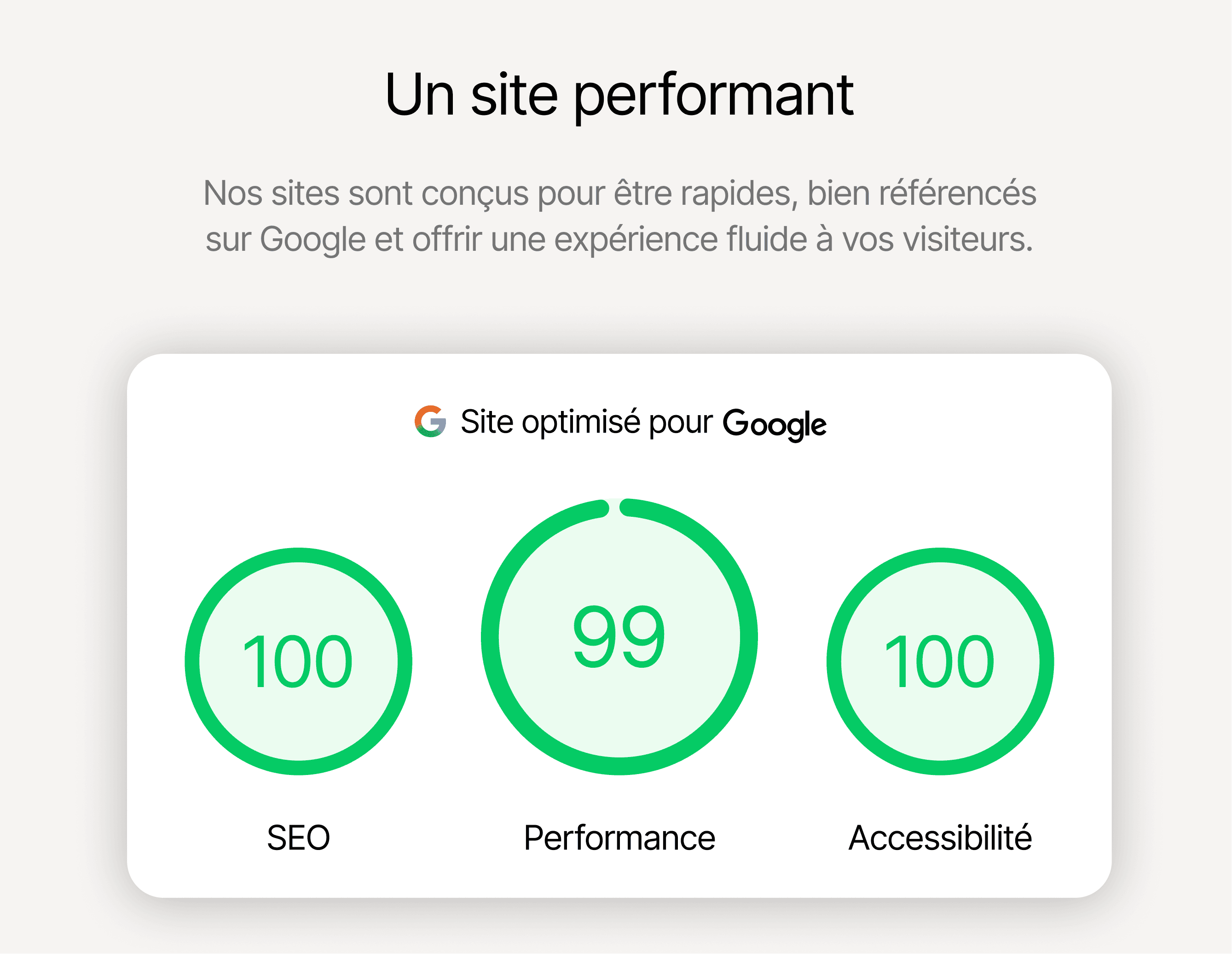 Young man in a green hoodie holding a yellow phone while seated at a table with a tablet.