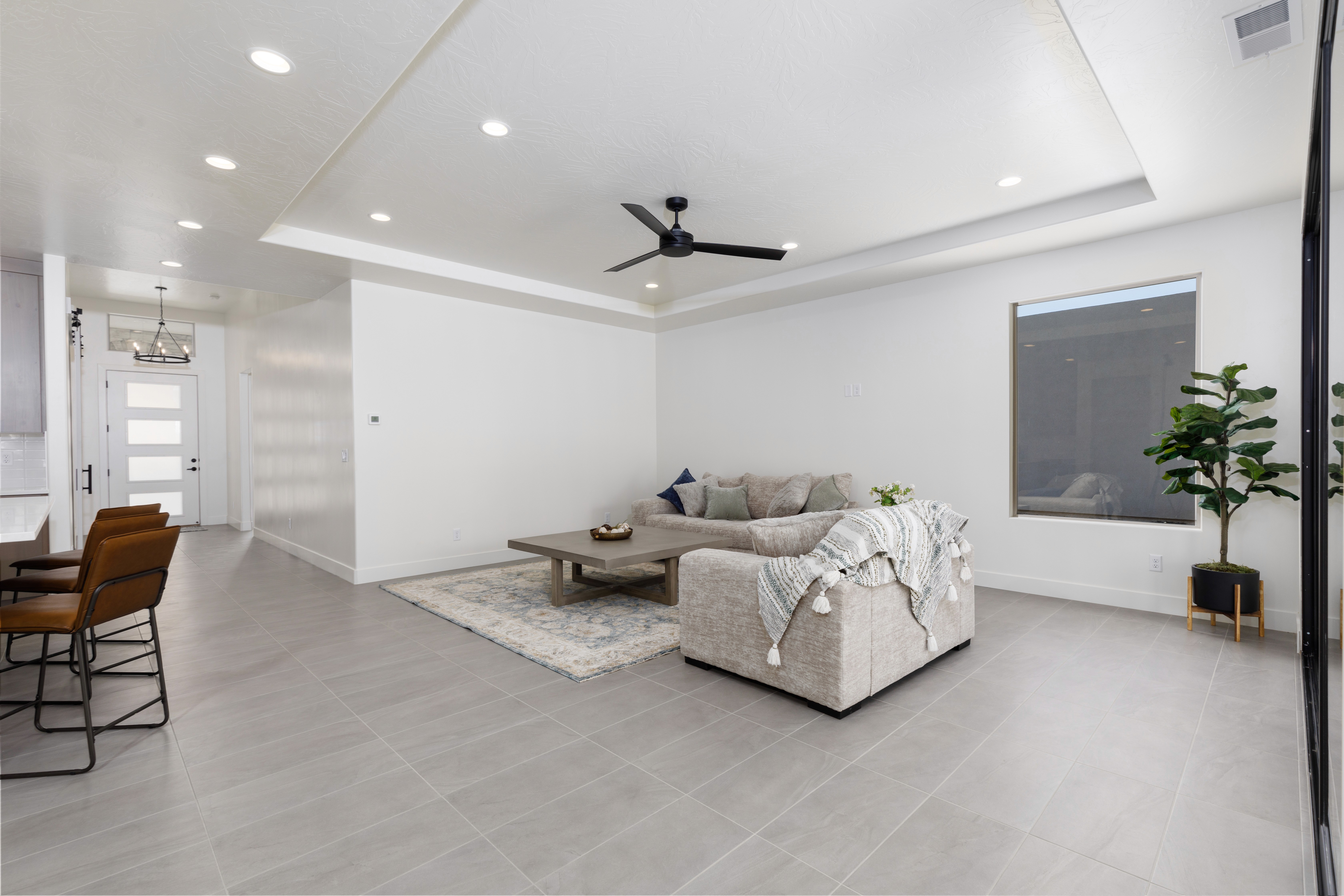 Living room in in a Hurricane, Utah home featuring a bright interior and comfortable open-concept design.