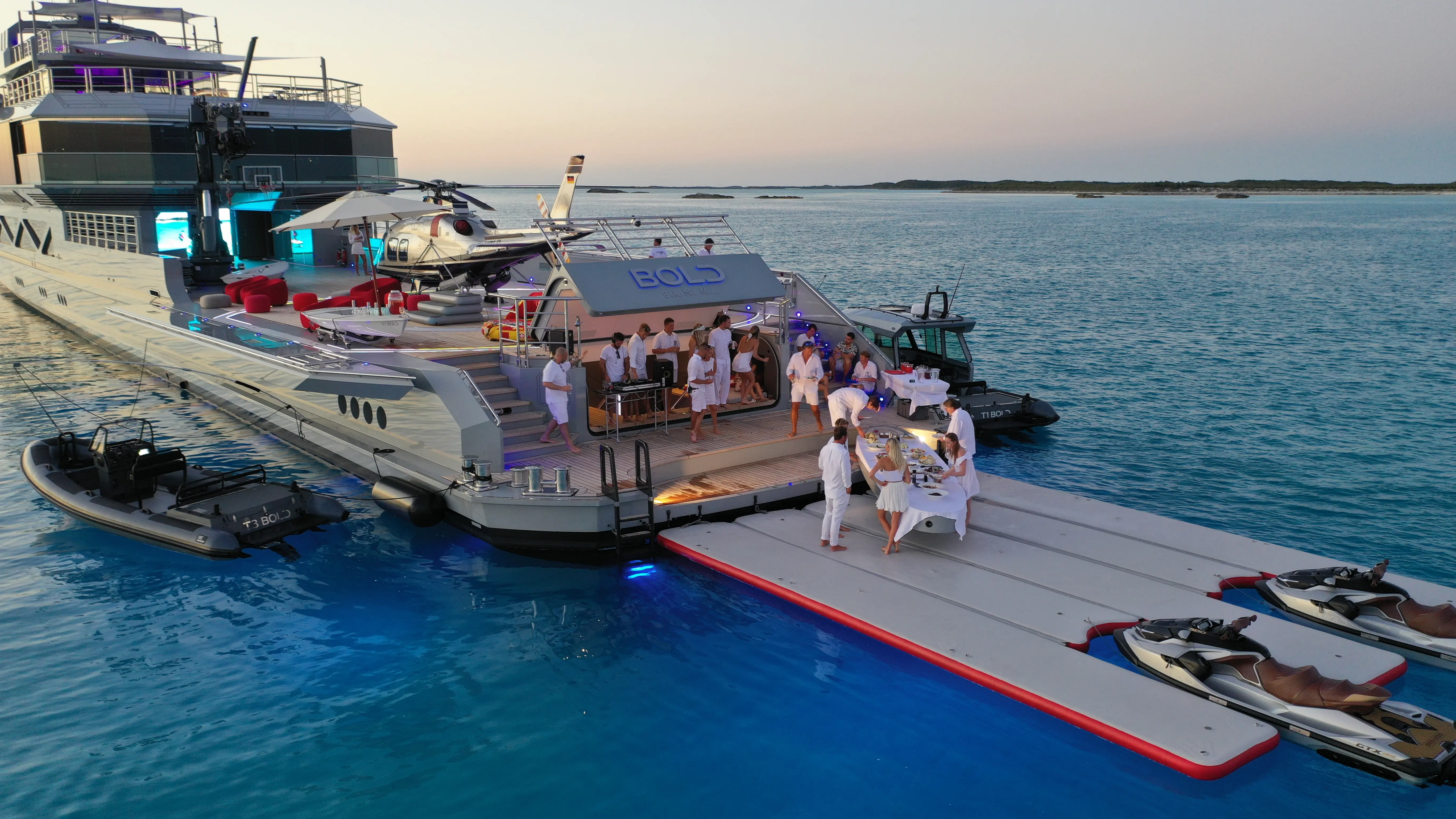 Modern open-air café with wooden seating and plants.