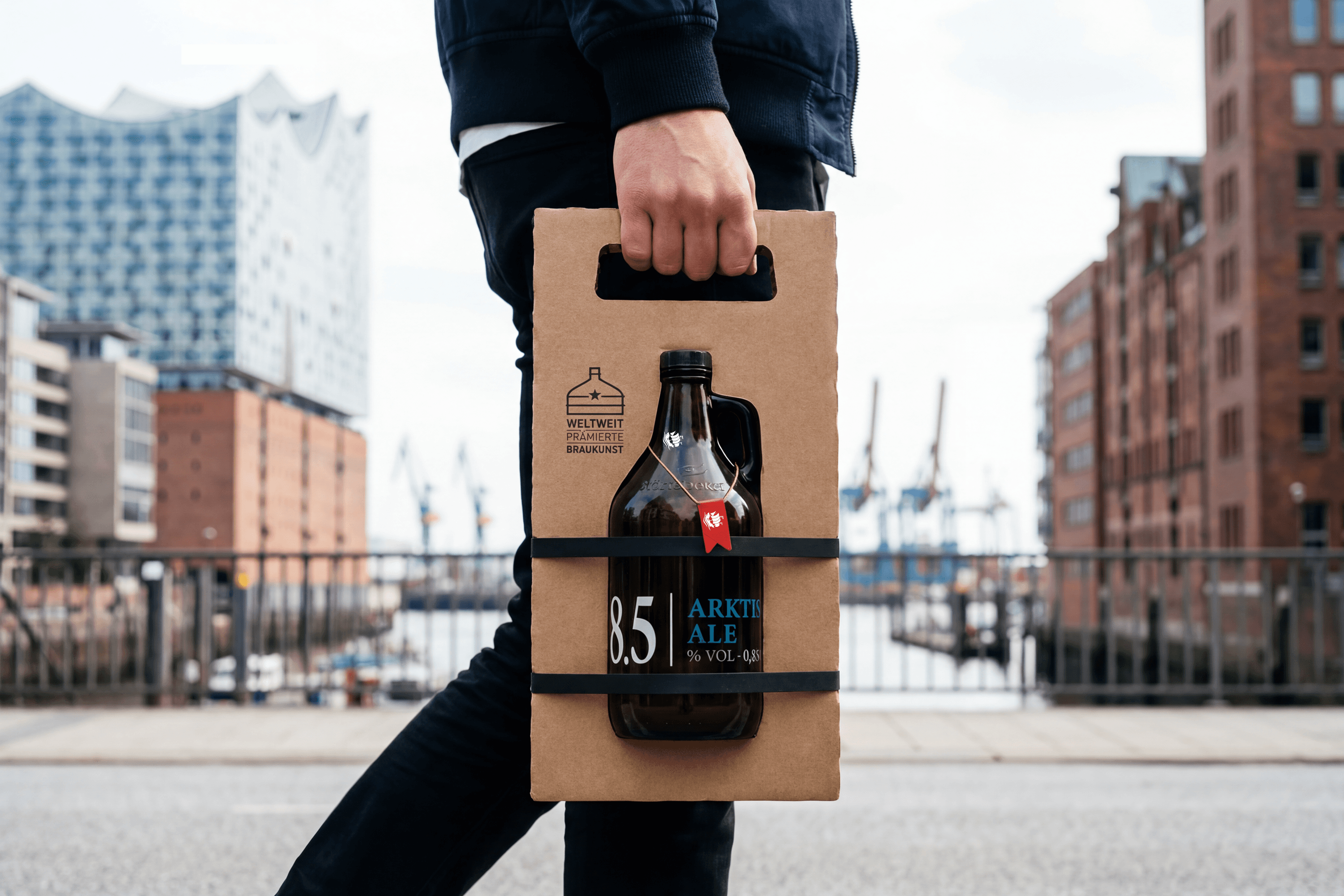 Man carrying a six-pack of beer with a red flag.