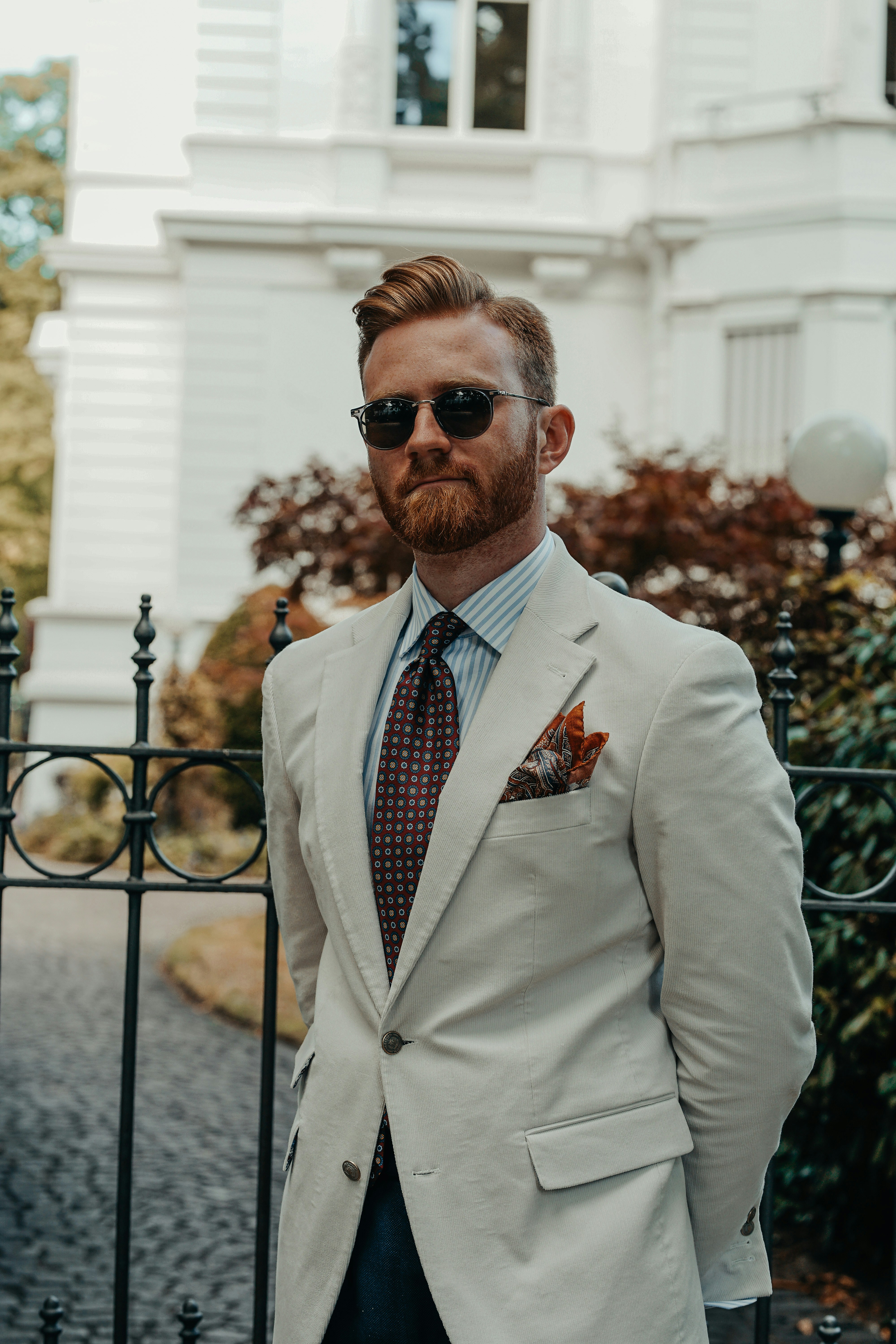 a man wearing sunglasses and a suit