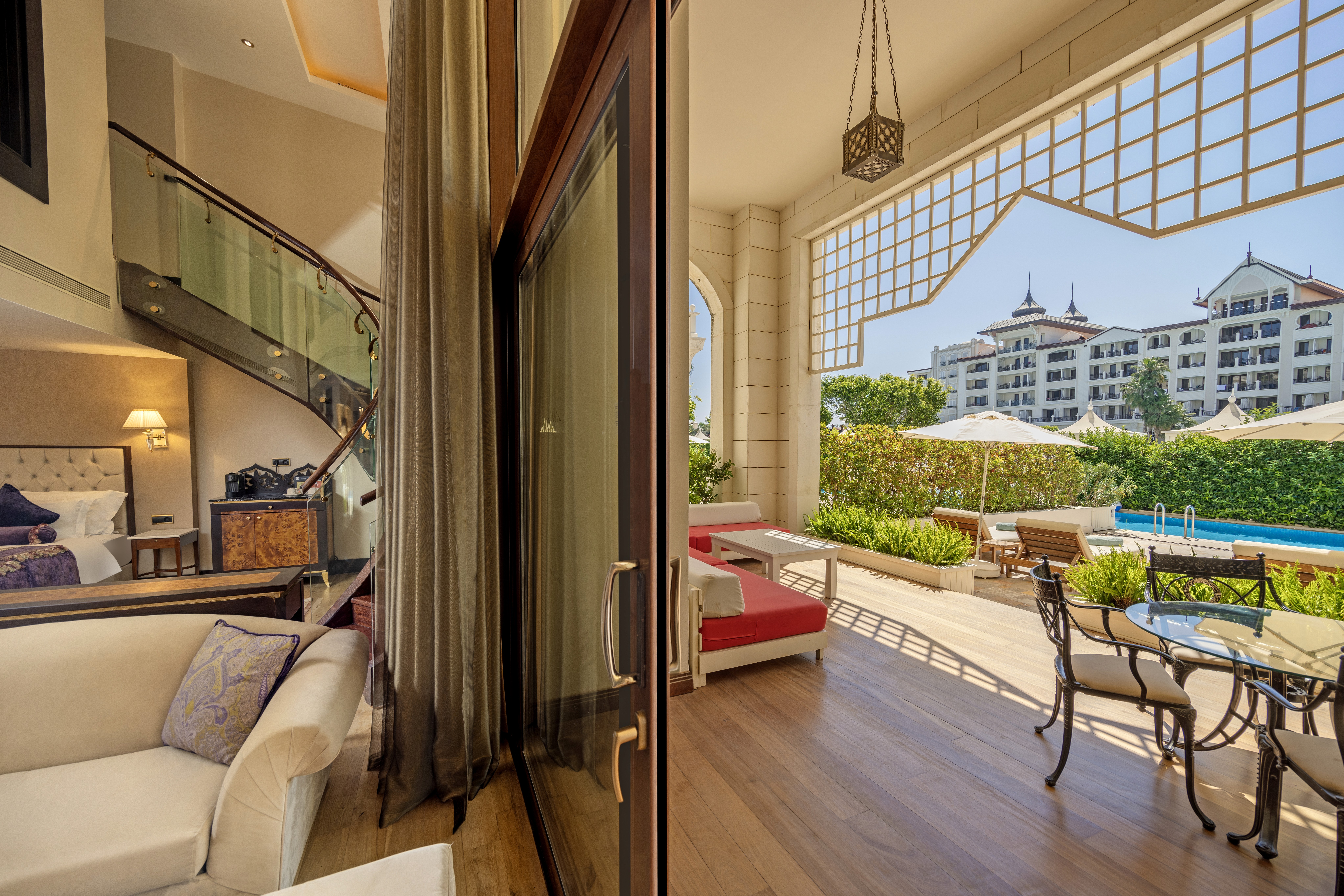 Two-level pool duplex suite featuring a spacious living area and elegant interior design.