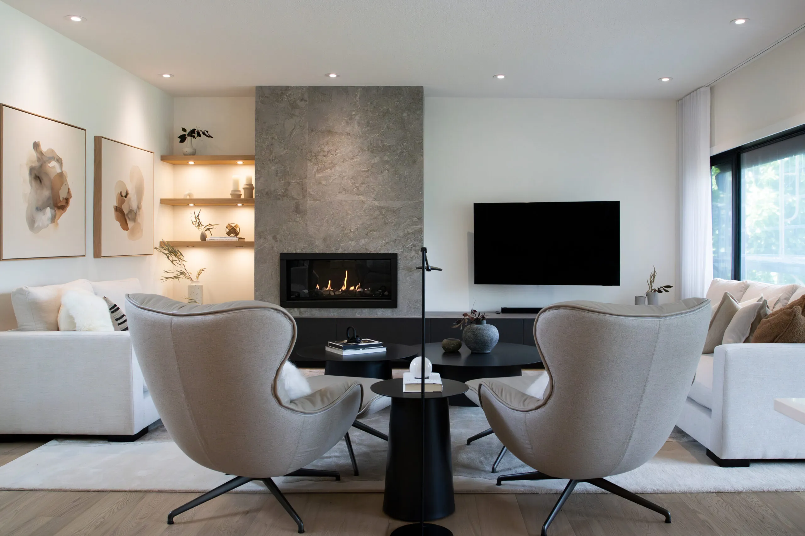 Image of living room with large gas fireplace and cozy furniture.