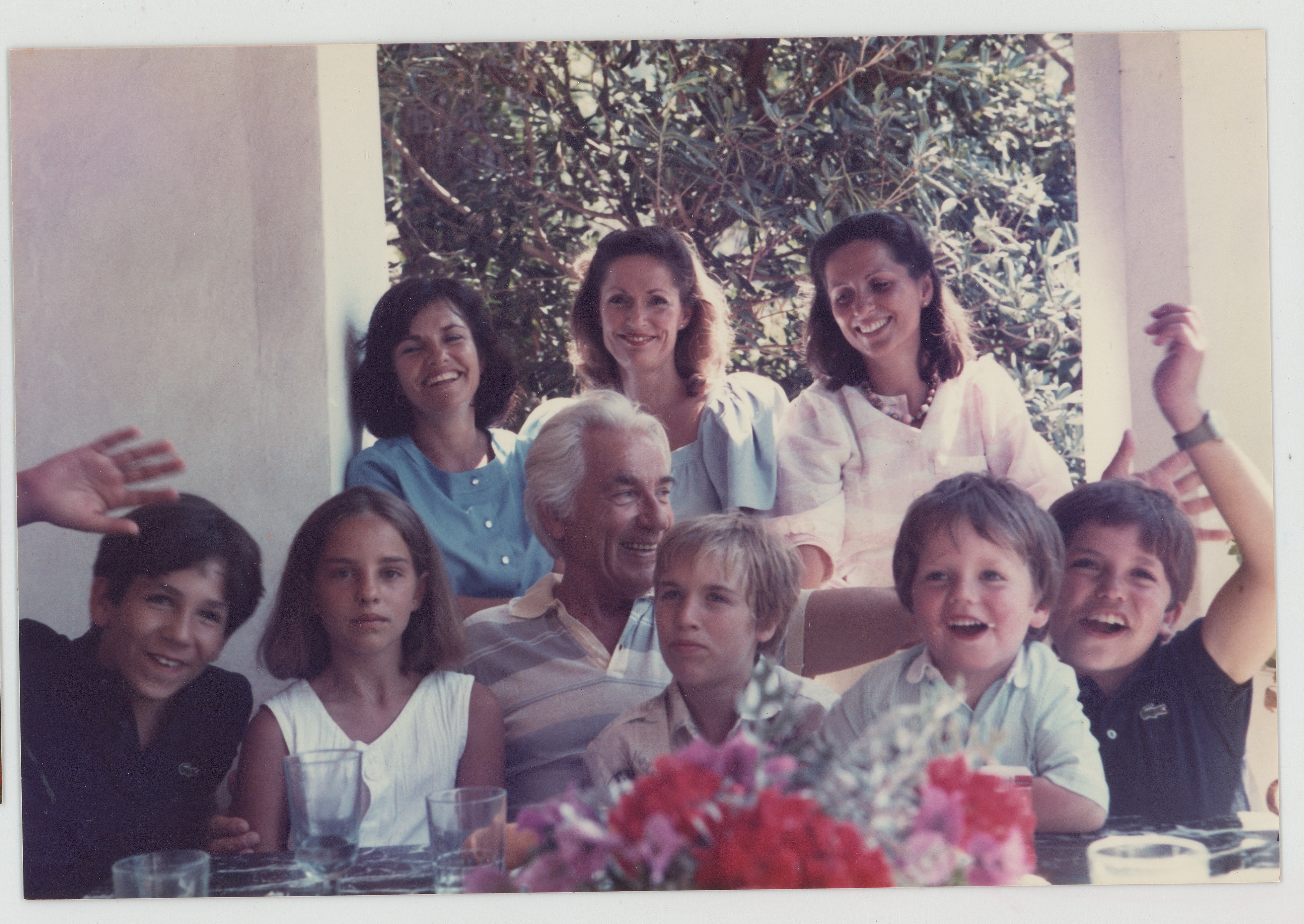 Vintage photo of the Los Primos family gathered around a table