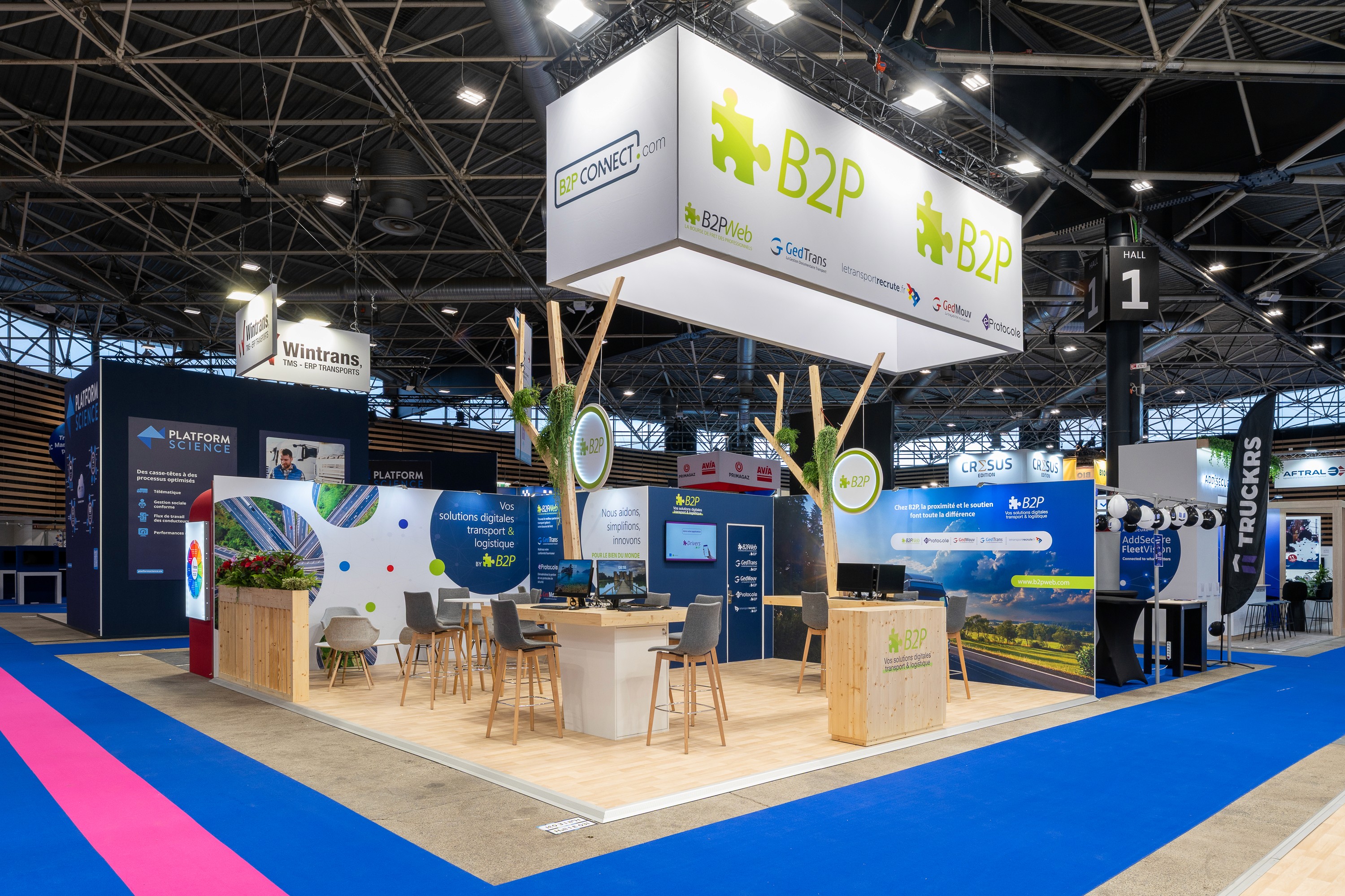 Stand B2PWeb Solutrans Lyon 2025 – vue d'ensemble scénographie lumineuse et ouverte, conception stand professionnel Expace