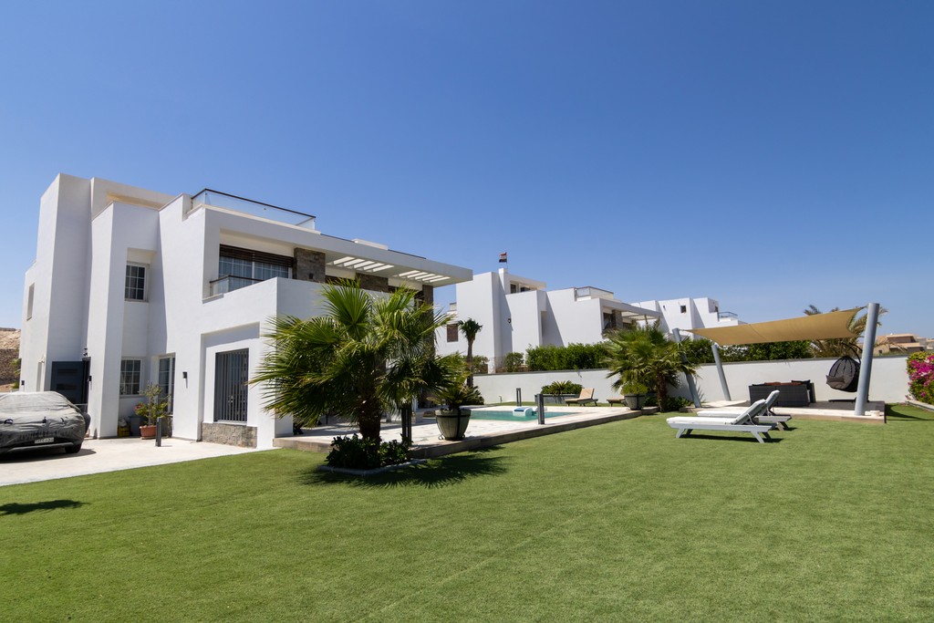 white and brown concrete building under blue sky during daytime