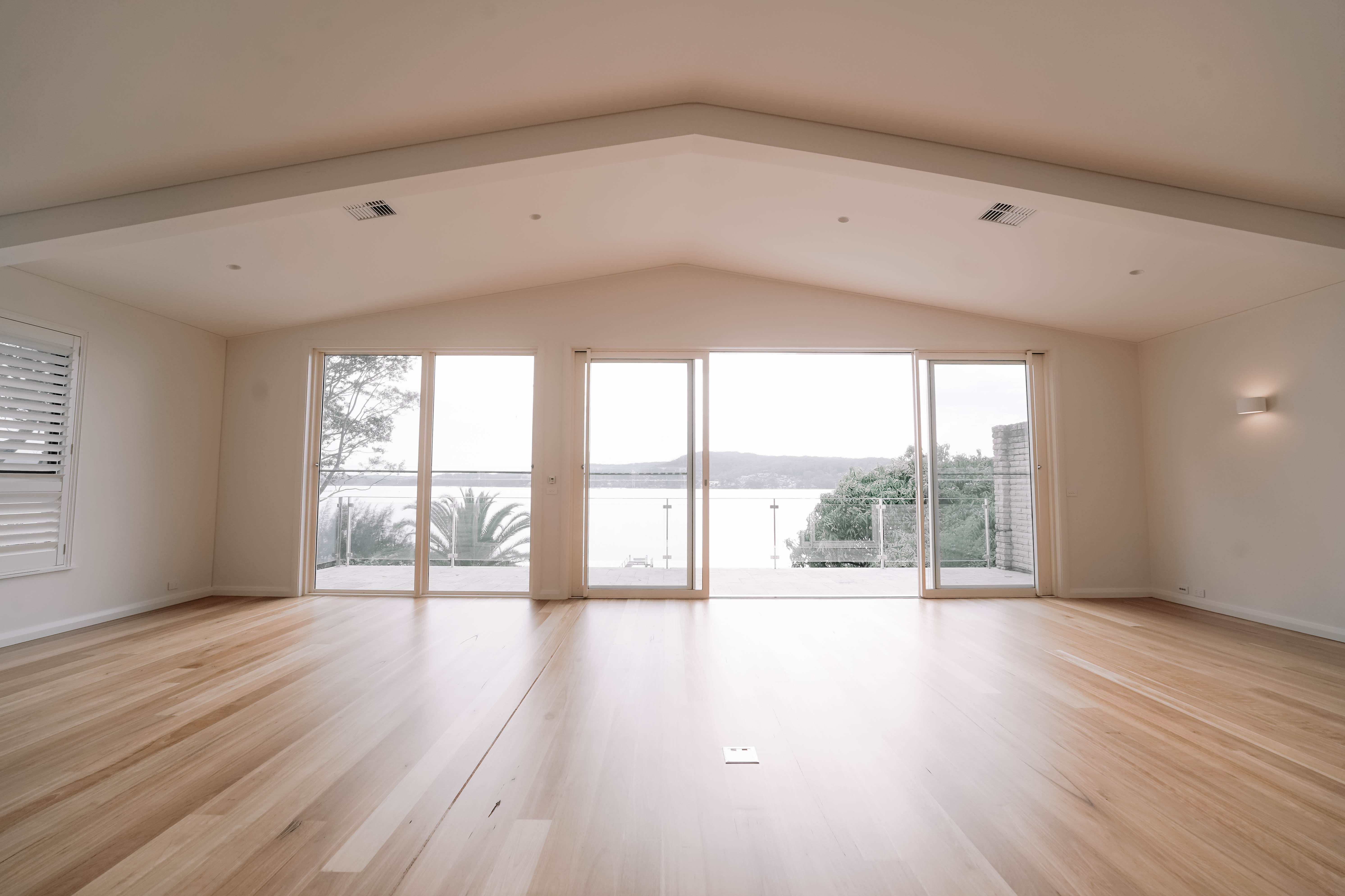 A waterfront home renovation that opened up the main living space and added a large entertainer’s kitchen, creating a seamless flow with spectacular views.