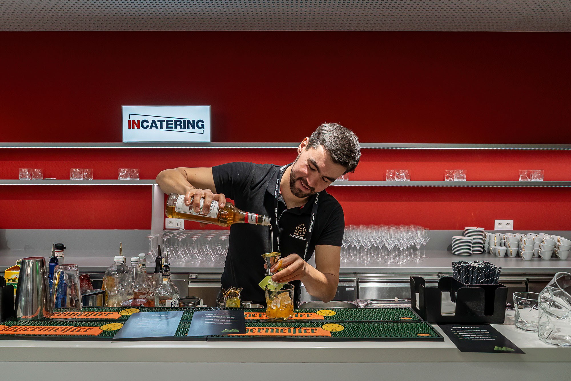 Audience applauding as an award recipient walks through the room during a formal corporate gala evening.