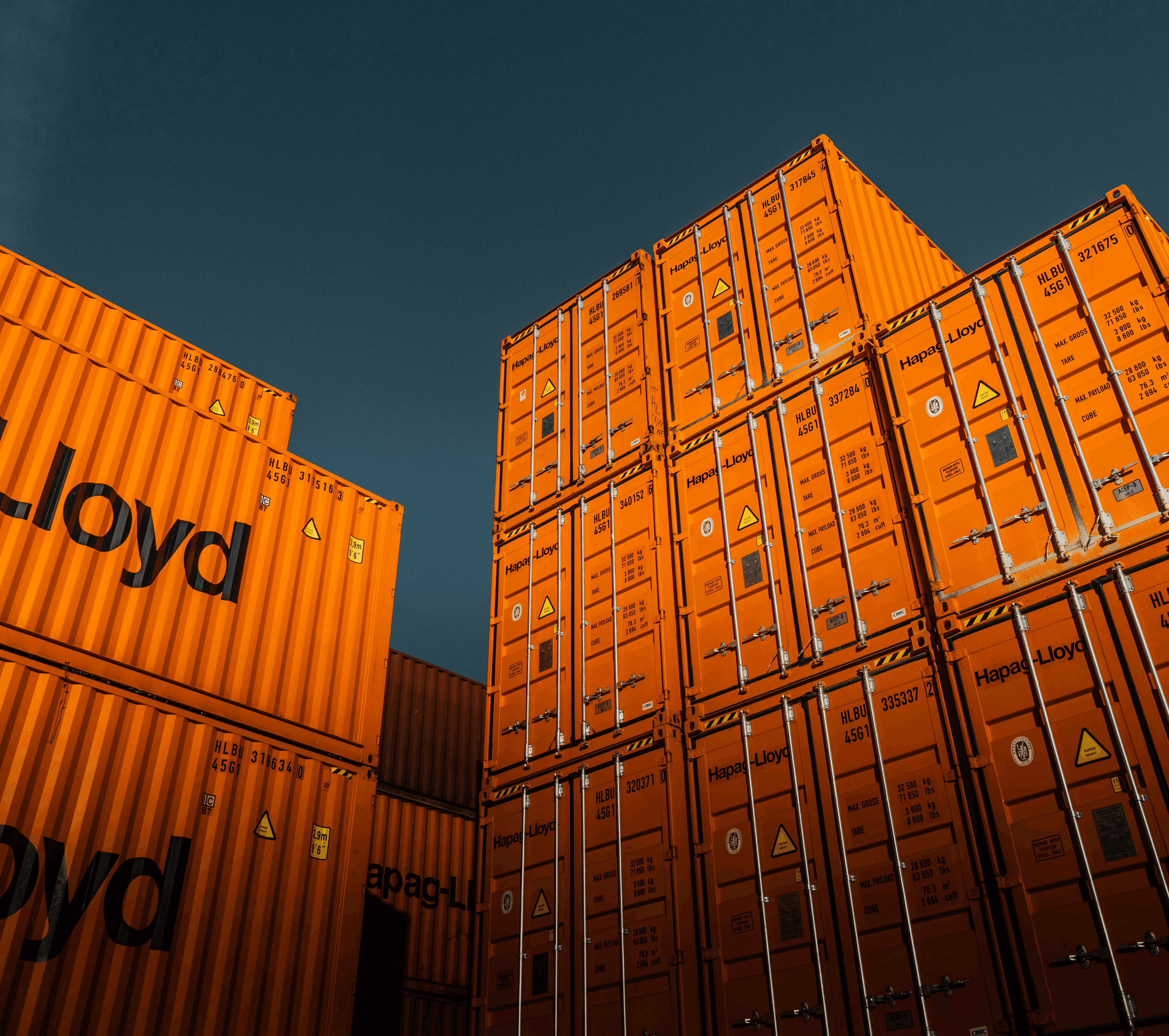 brown cardboard boxes under blue sky during daytime