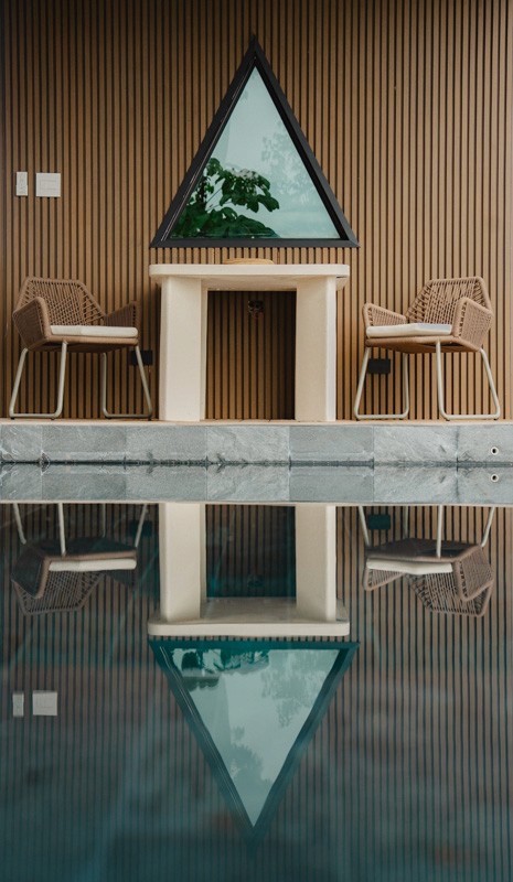 Private plunge pool and sun deck overlooking tropical gardens and an ocean sunset at the rental property.